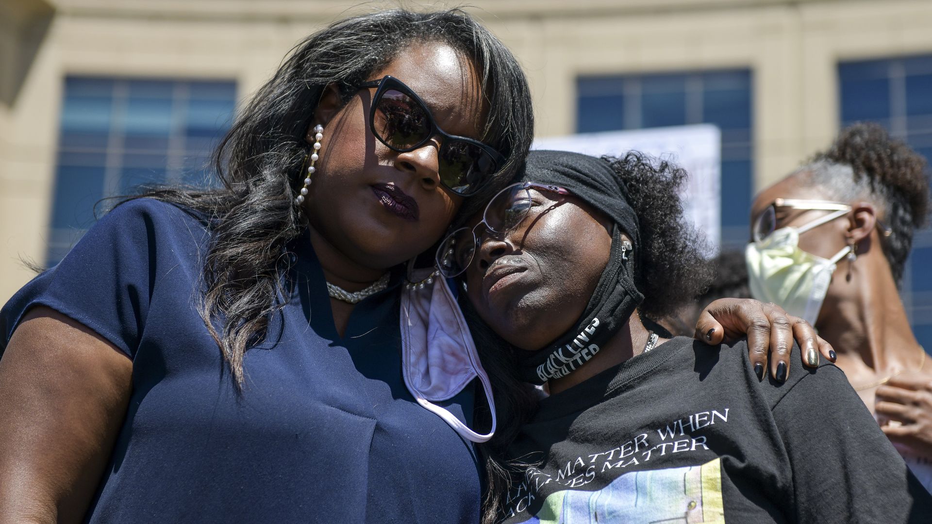 State Rep. Leslie Herod, left, hugs Elijah McClain's mother, Sheneen McClain, at a 2020 rally in Aurora. 
