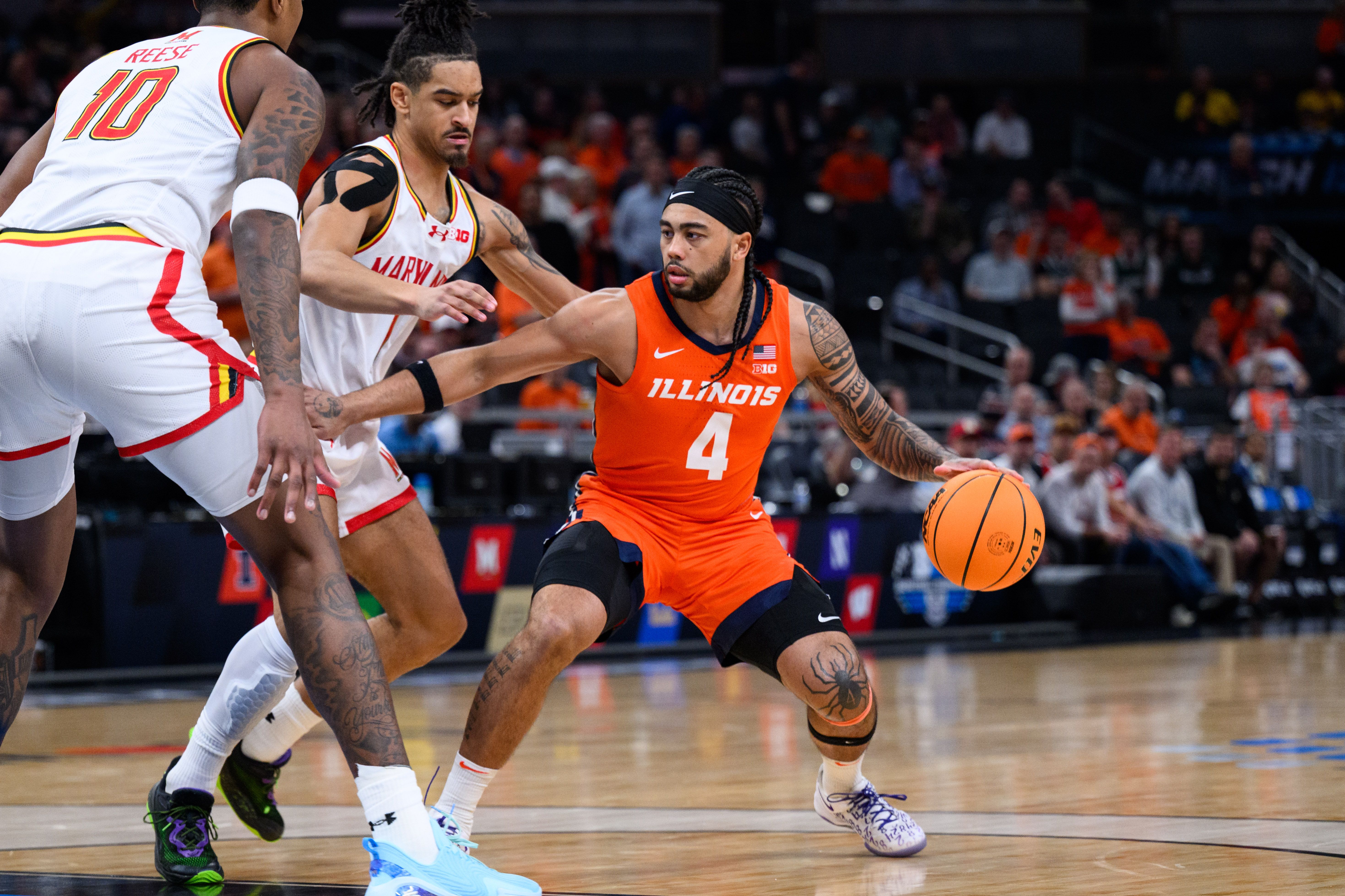 Photo of a basketball player dribbling the ball in a game 