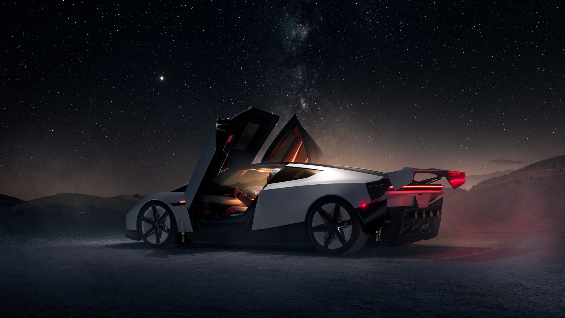 Futuristic silver Tesla Roadster sports car with open gull-wing doors sits on a dark desert, red interior glow visible. A starry night sky and the Milky Way stretch overhead.