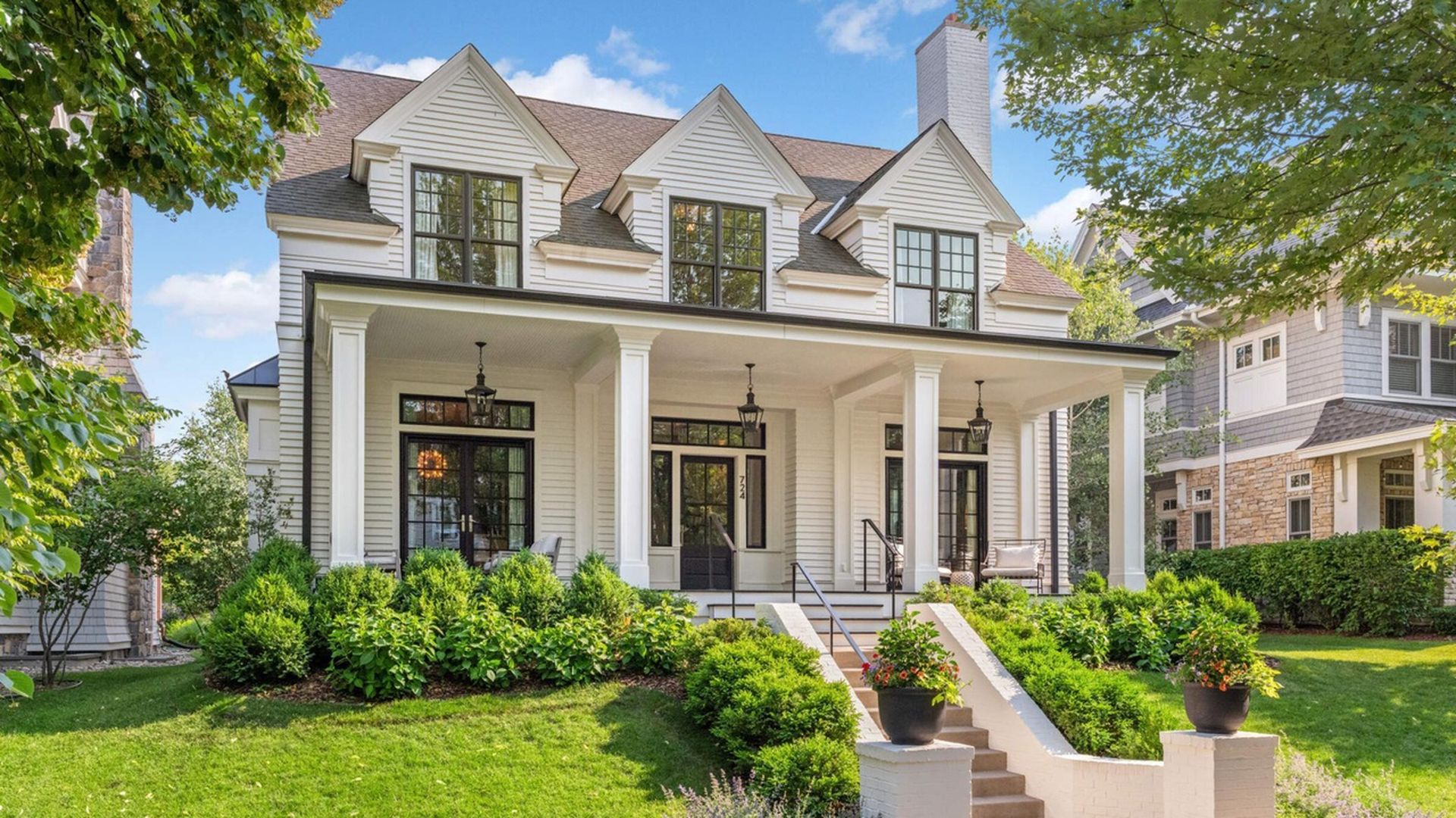 front view of home with open porch and steps
