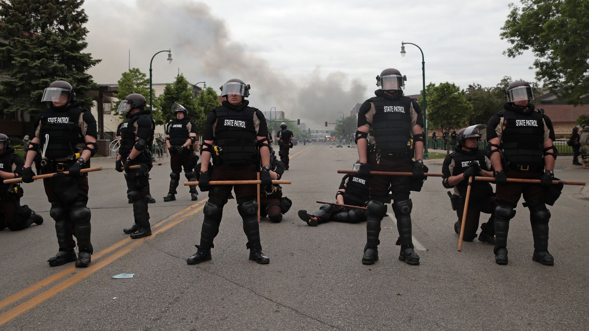 Police officers block a road on the fourth day of protests on May 29, 2020 in Minneapolis, Minnesota.