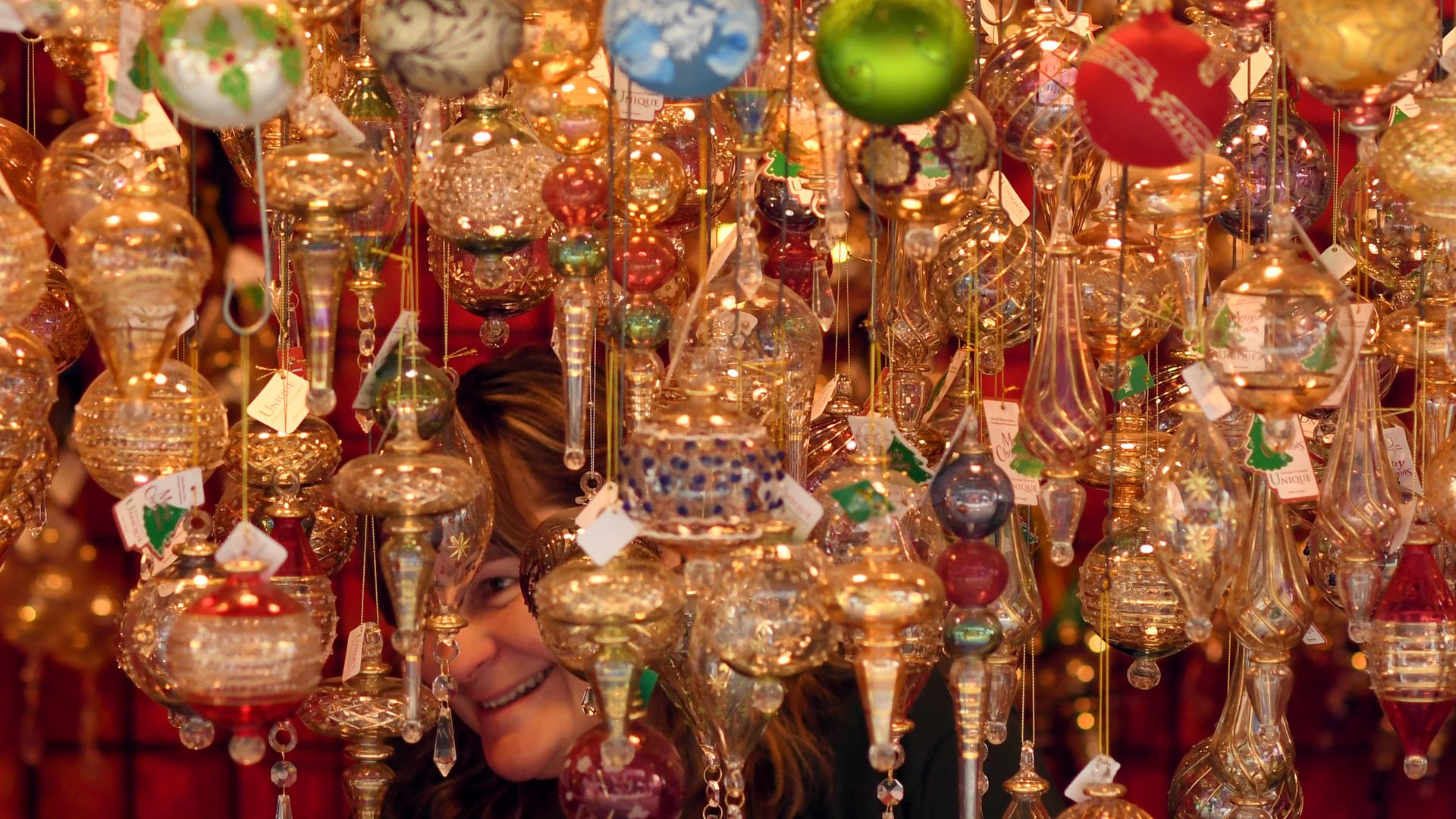 A woman shops for holiday ornaments at the Denver Christkindlmarket in 2017. Photo: RJ Sangosti/The Denver Post via Getty Images