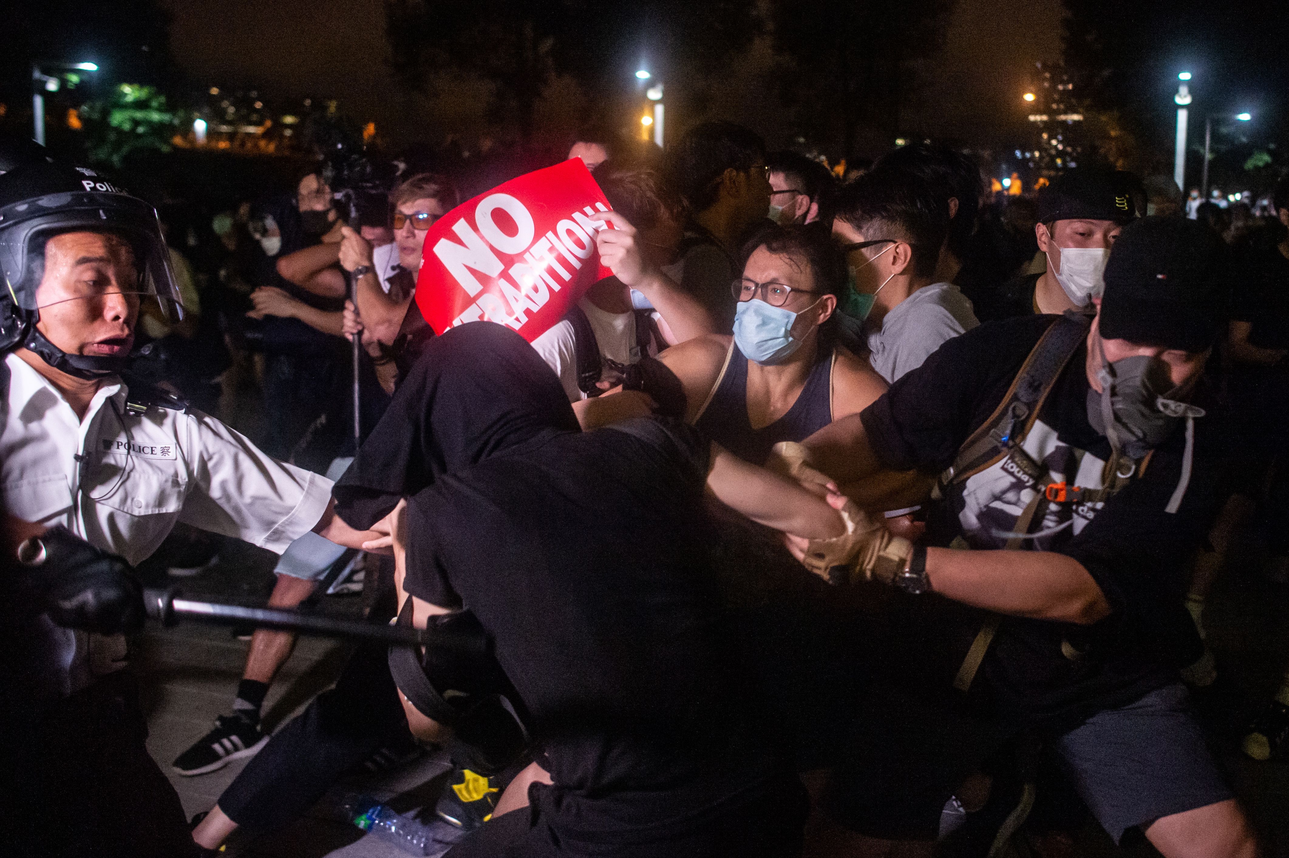 Protesters clash with the police at Legislative Council in Hong Kong after a rally against a controversial extradition law proposal in Hong Kong on early June 10, 2019.