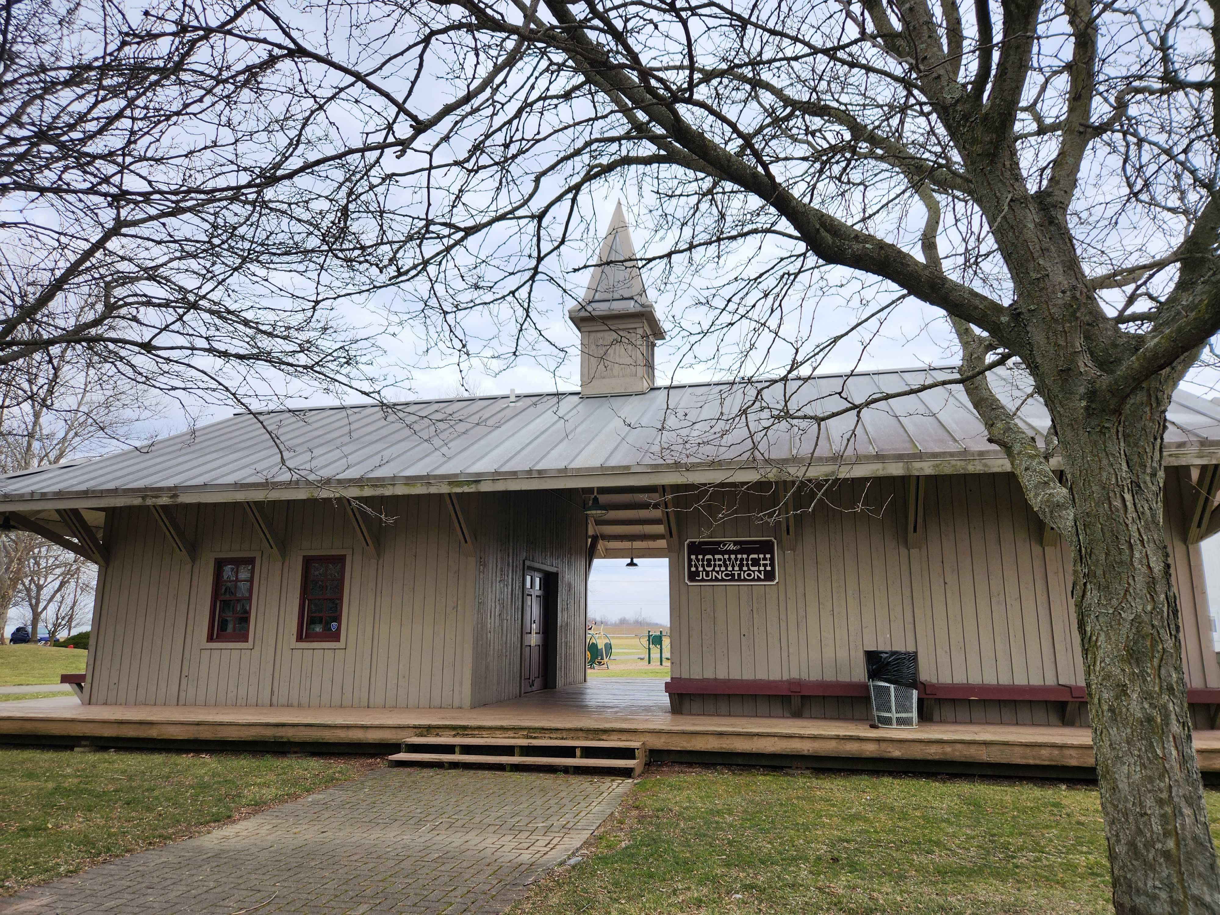 A park building with the sign reading "Norwich Junction."