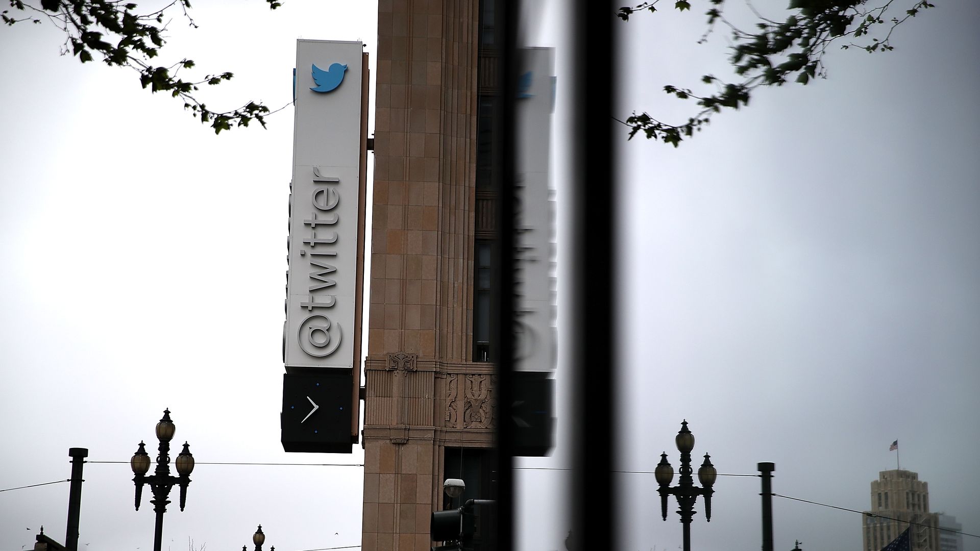 A sign with Twitter's logo hangs on the outside of the company's San Francisco headquarters