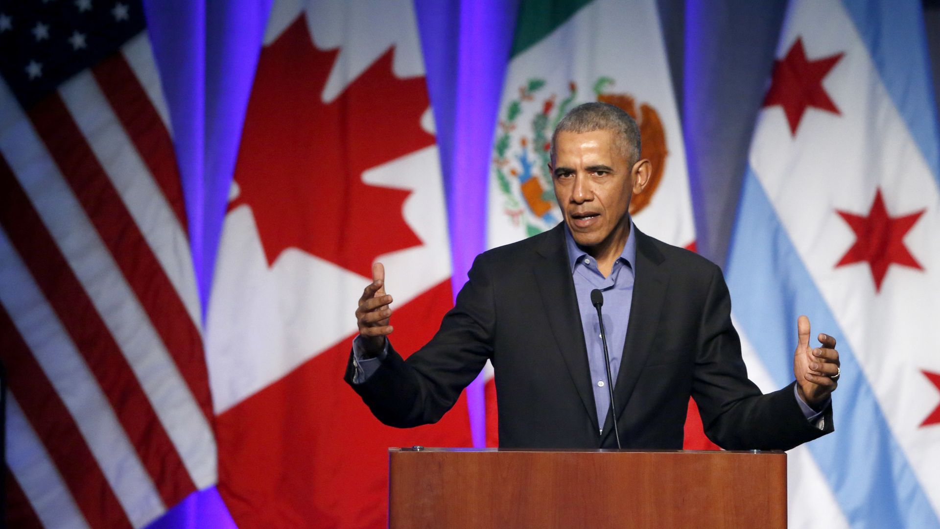 Former U.S. President Barack Obama address the participants at a summit on climate change.