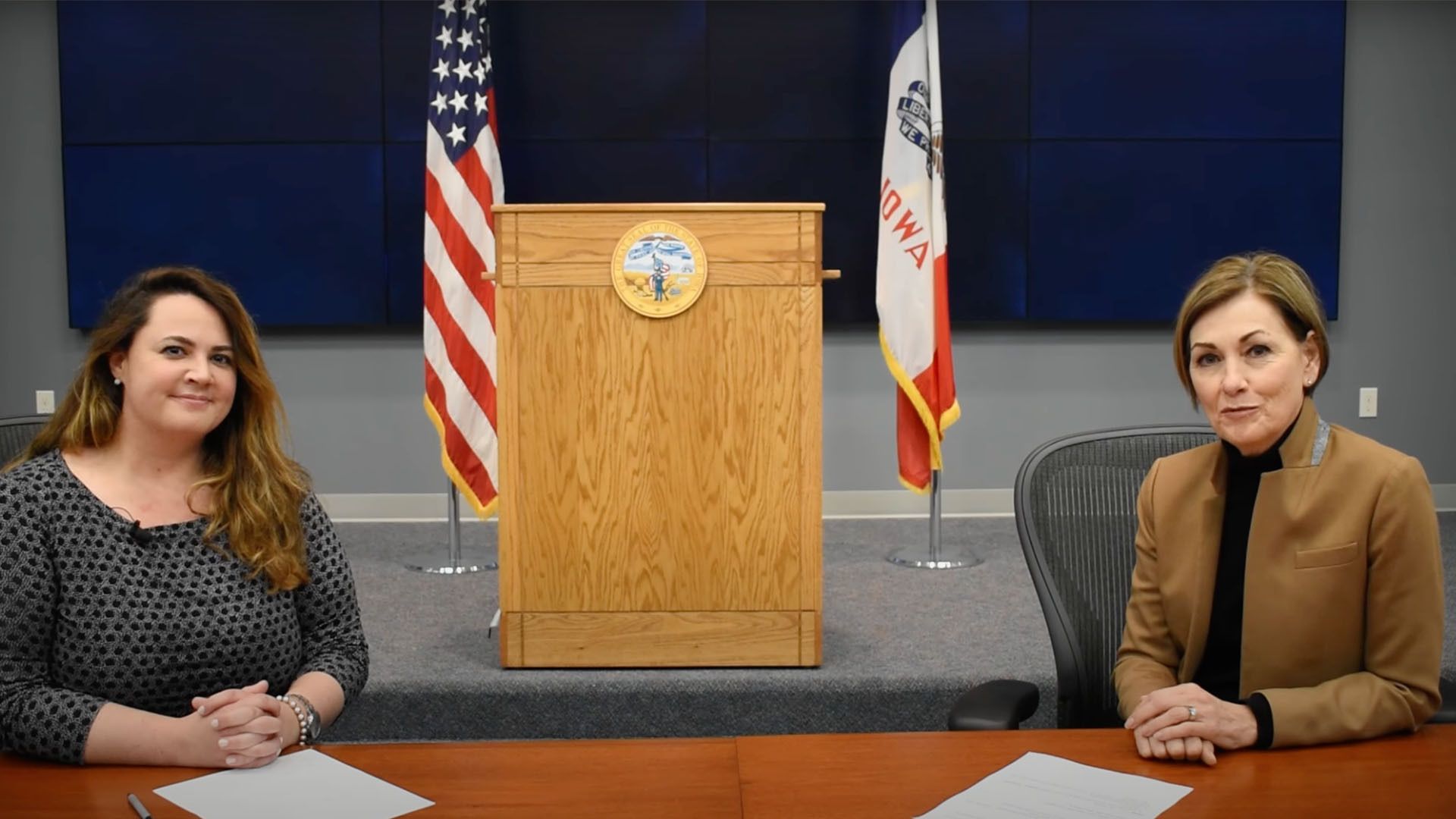 A photo of Dr. Caitlin Pedati and Gov. Kim Reynolds.