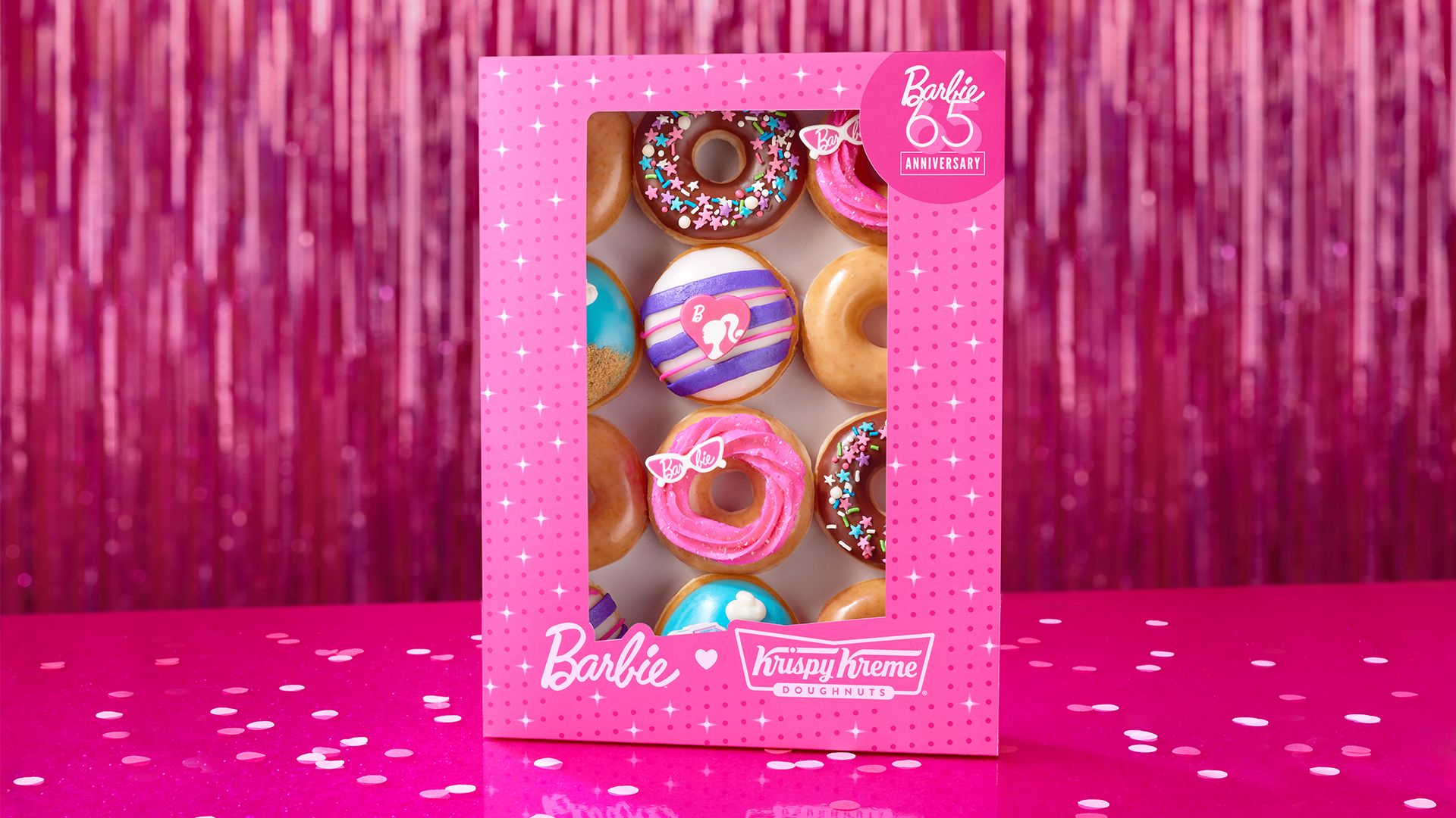 Barbie Krispy Kreme Doughnuts collection in a pink box that looks like the iconic doll's box with bright colored doughnuts