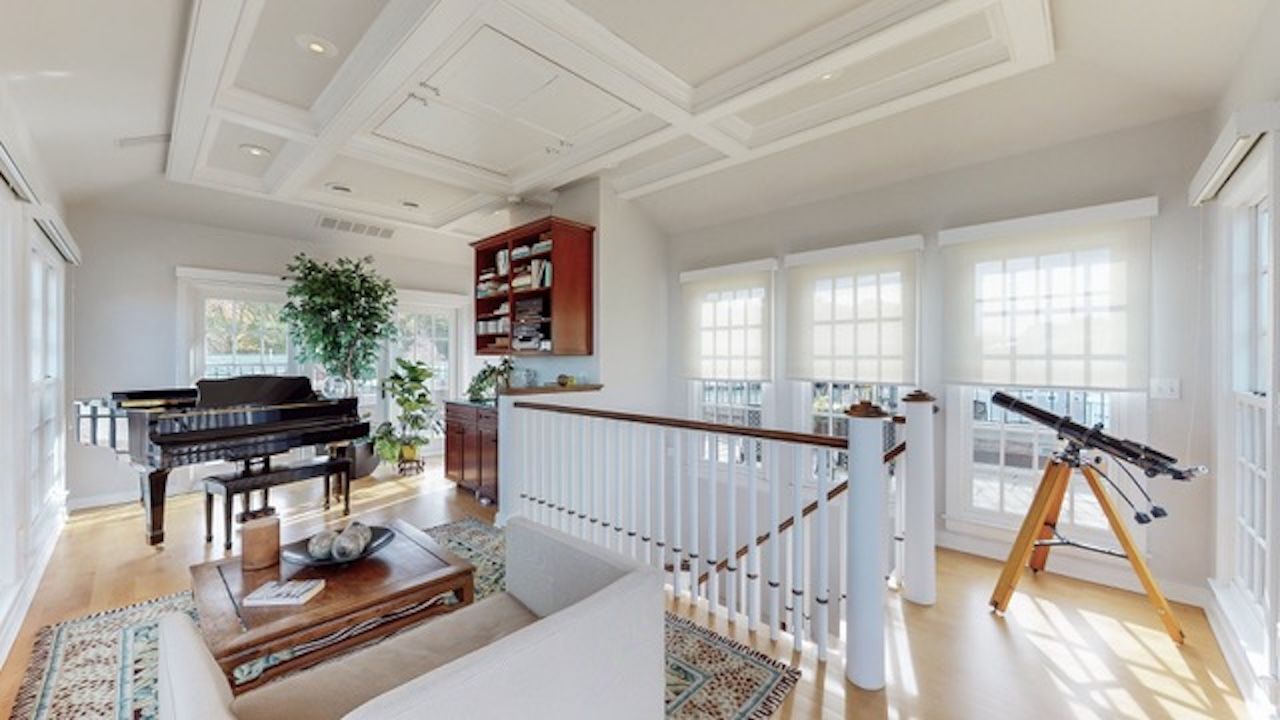 Interior photo of nice house for sale, piano and telescope in room