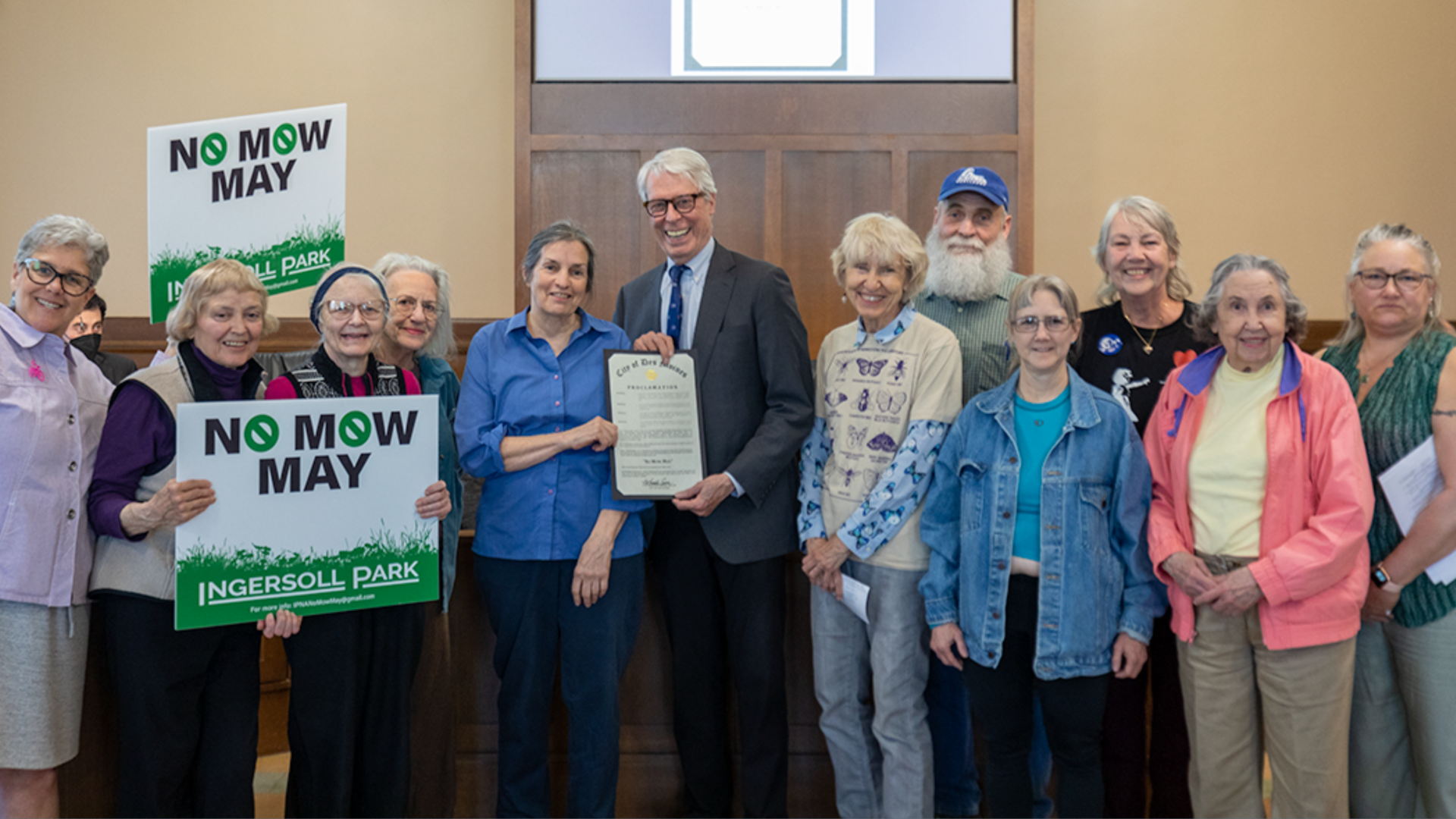 A photo of Des Moines Mayor Frank Cownie at No Mow May last year.
