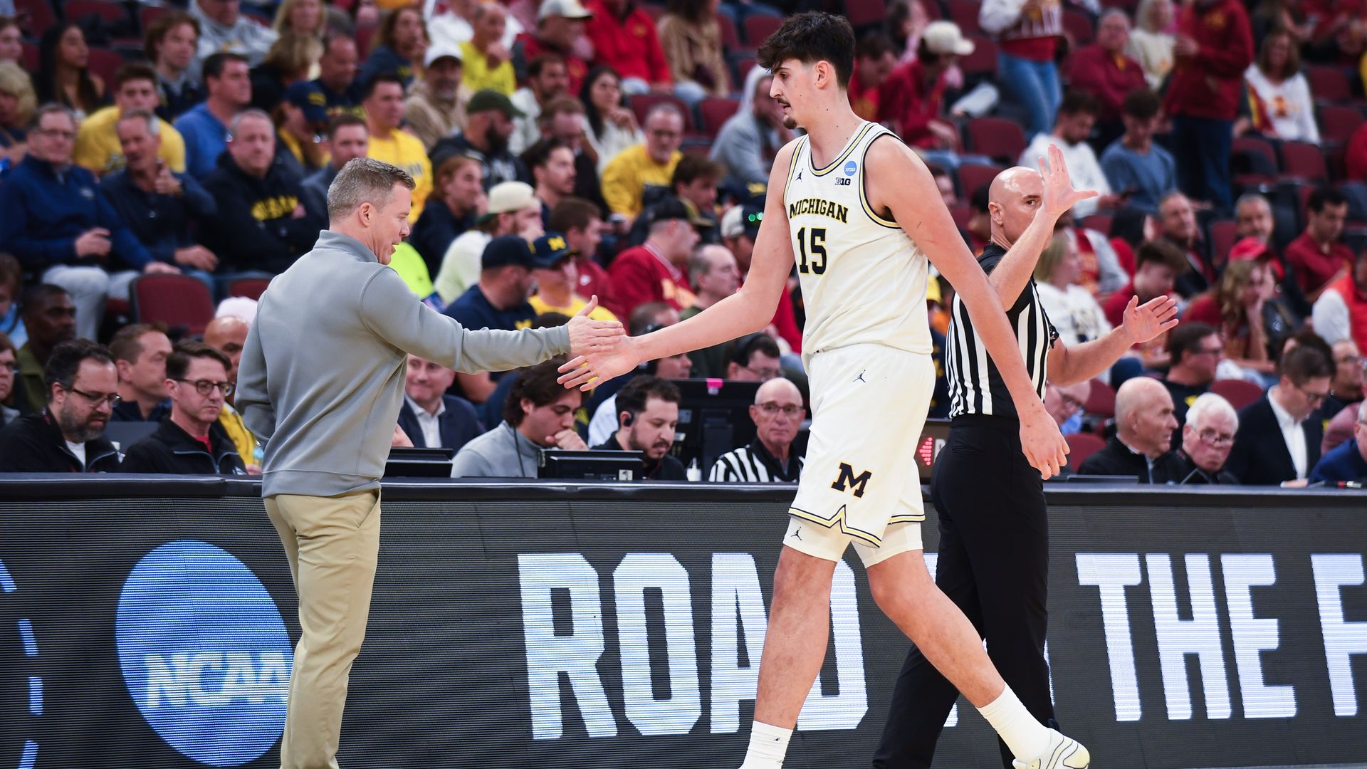 Coach Dusty May on the sideline with Aday Mara during U-M's Sweet Sixteen win over Alabama.