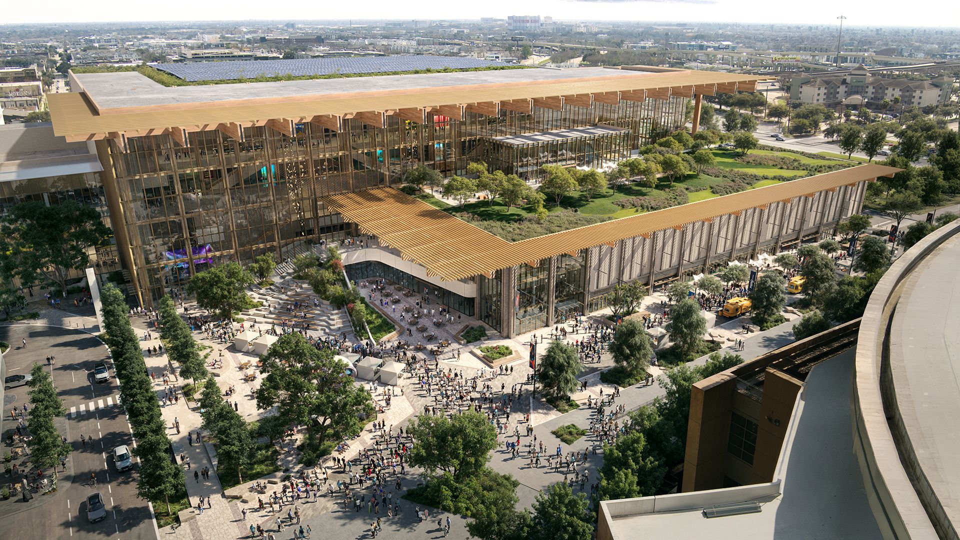 An aerial rendering of a modern glass-and-gold complex featuring a rooftop garden and a long wooden-slat canopy over a bustling plaza. People walk among trees, steps, and glass-walled interiors.
