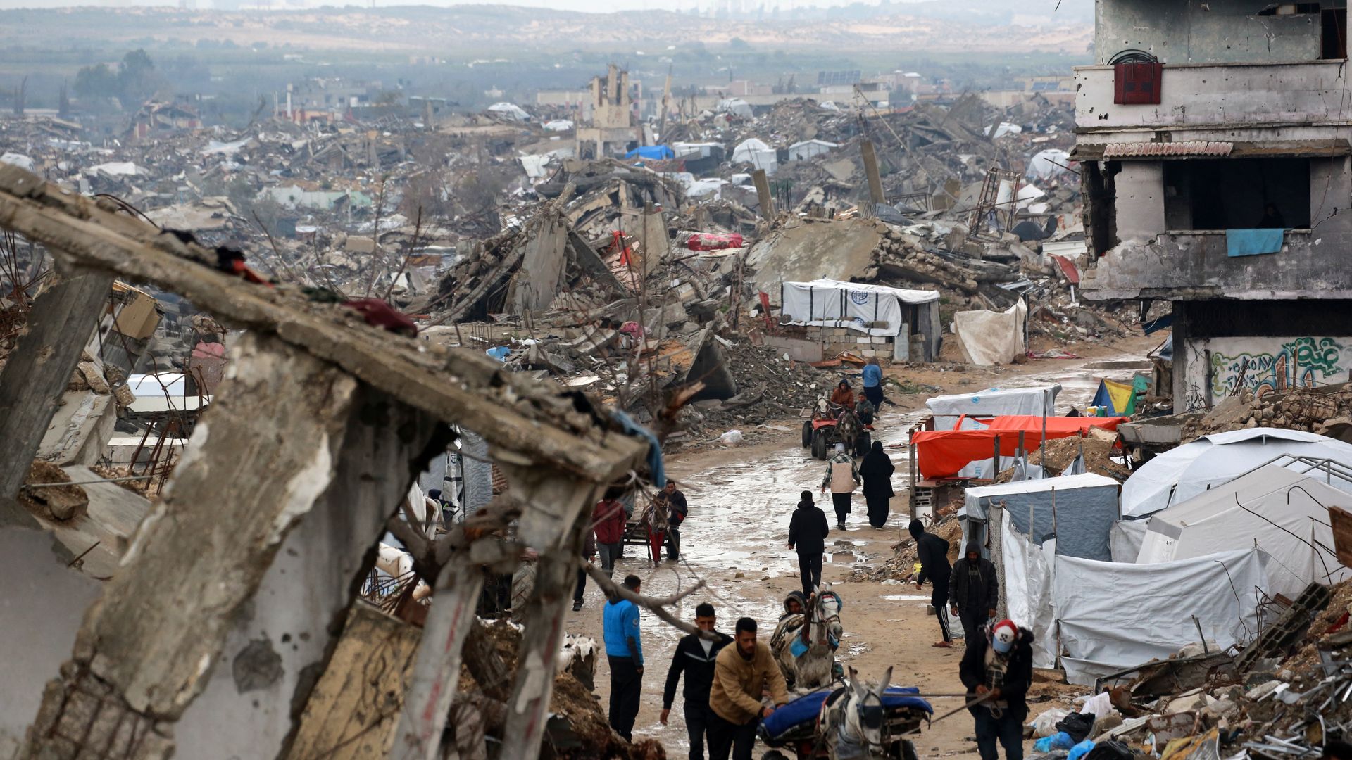 Palestinians flee with their belongings Beit Lahia in the northern Gaza Strip on March 21, 