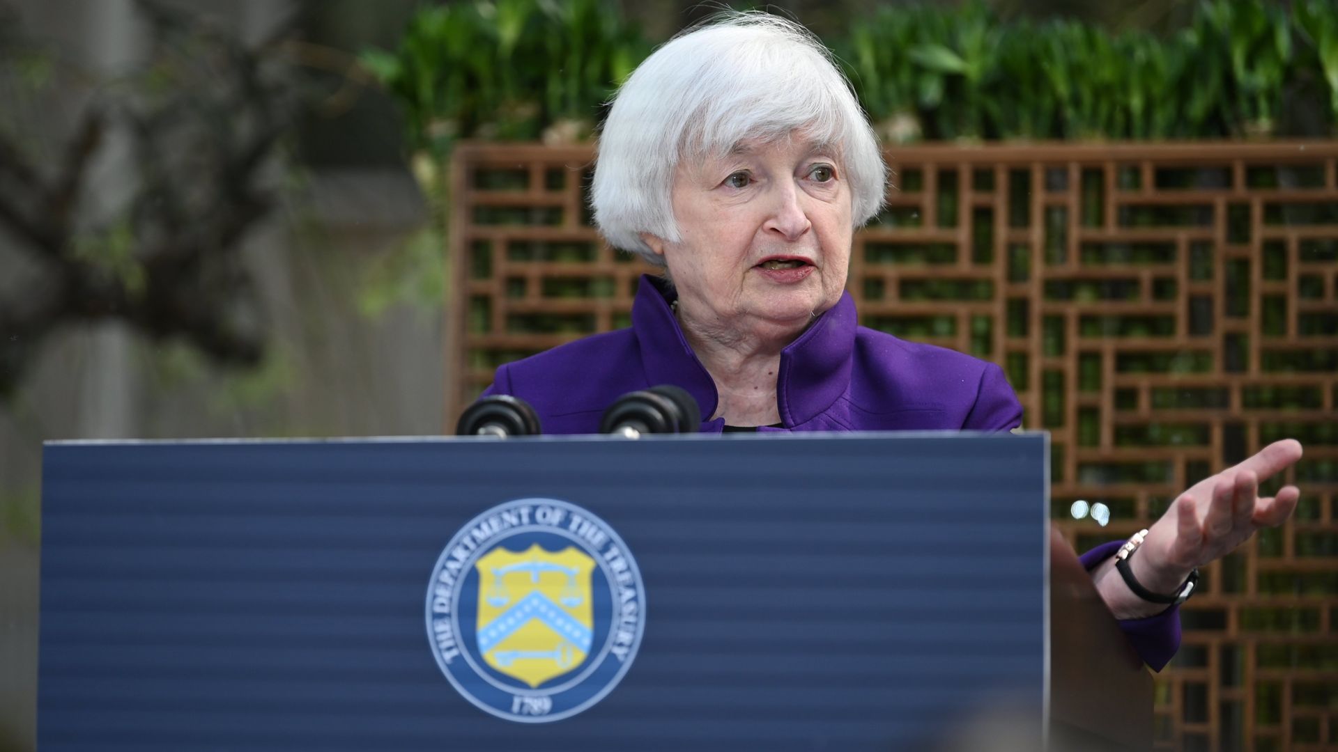 Yellen speaks at a podium in Beijing