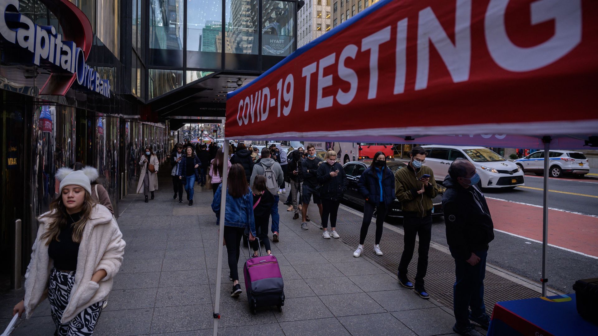 People line up at a streetside COVID testing center in NYC