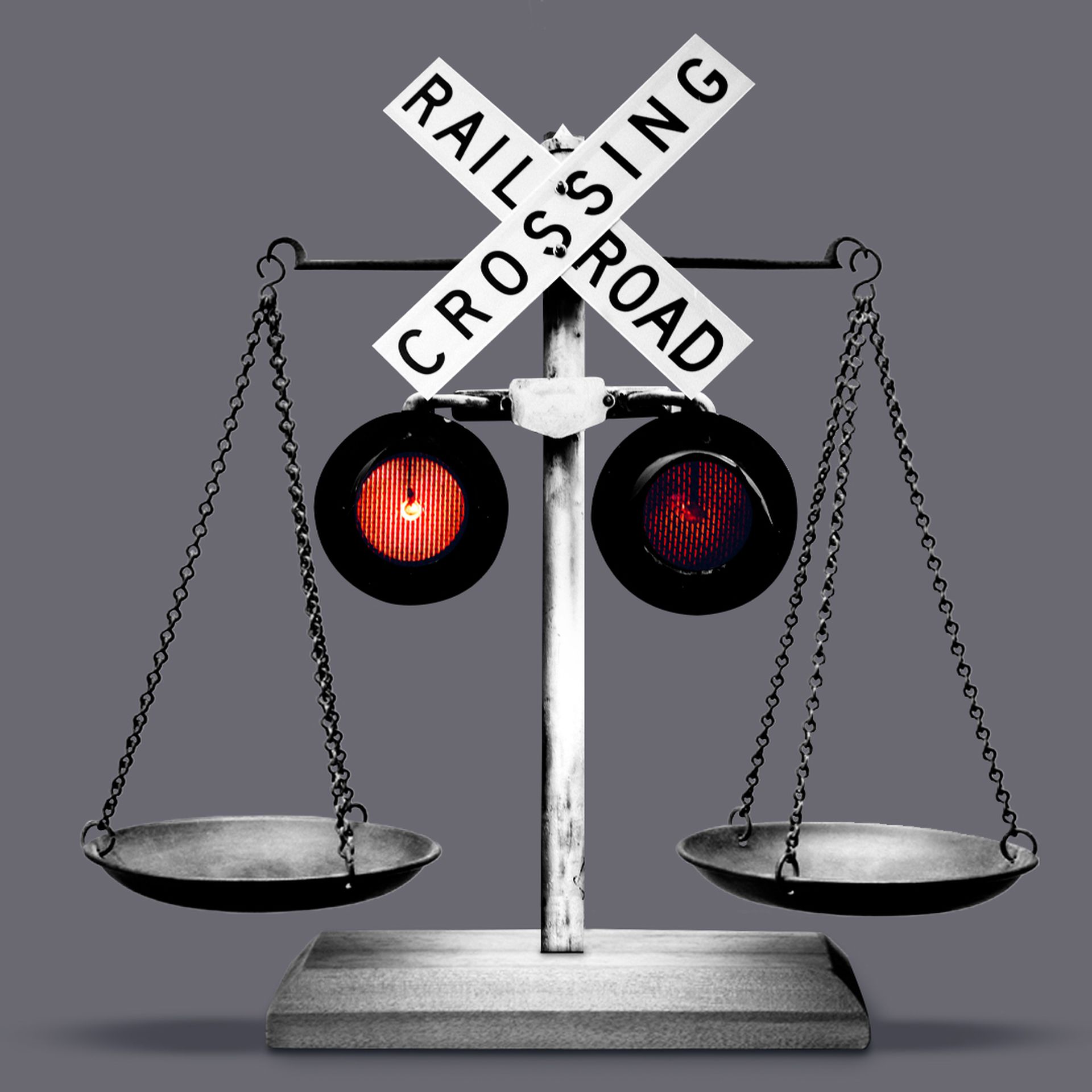 An illustration of scales with railroad crossing lights blinking