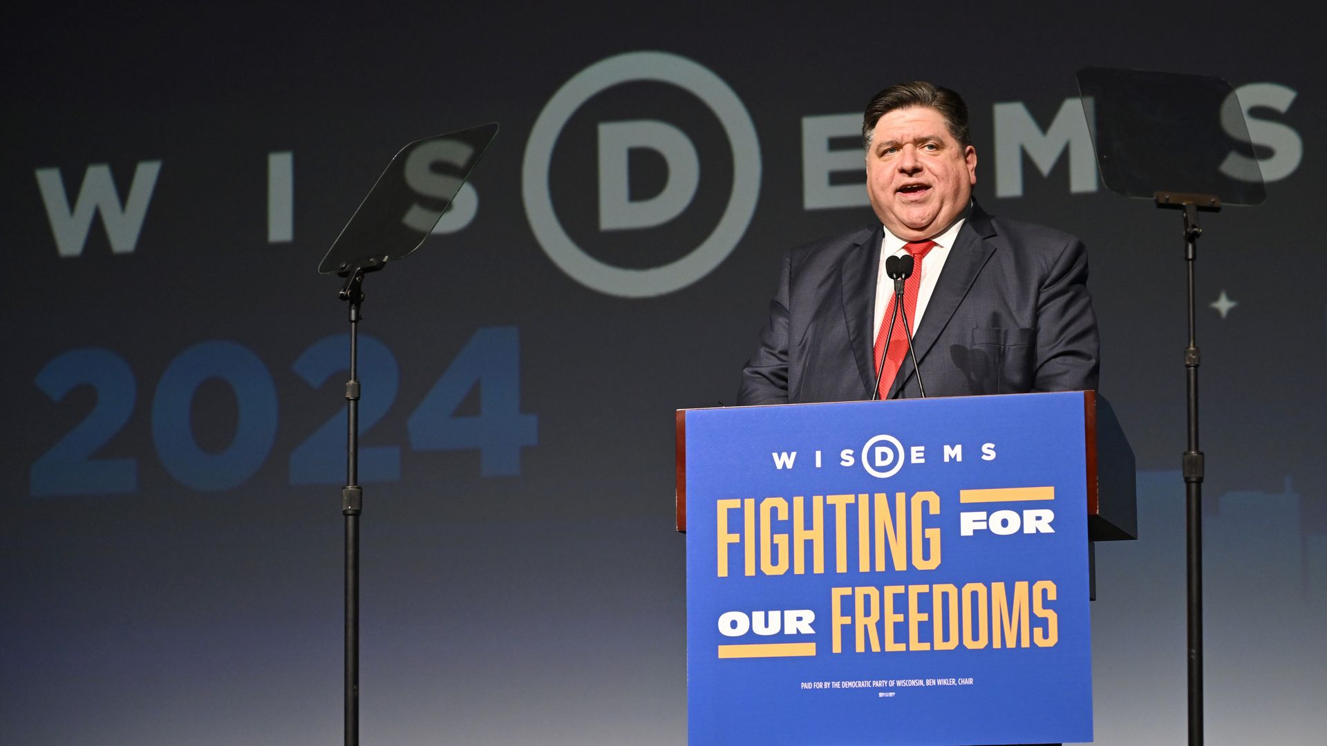 Photo of a man behind the podium 