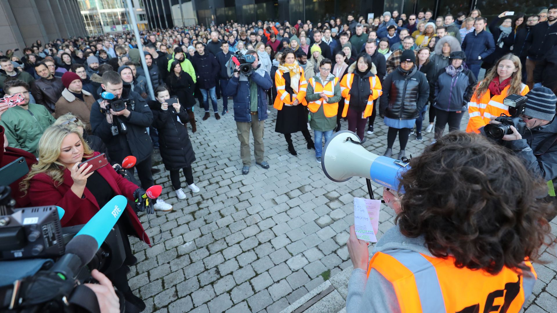 Google employees stage a walkout, gathered in a circle