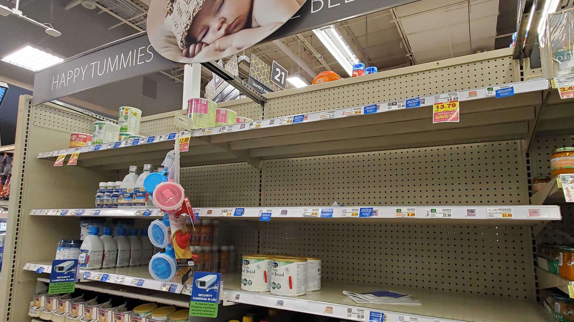 Half-empty shelves at a store's baby food section.