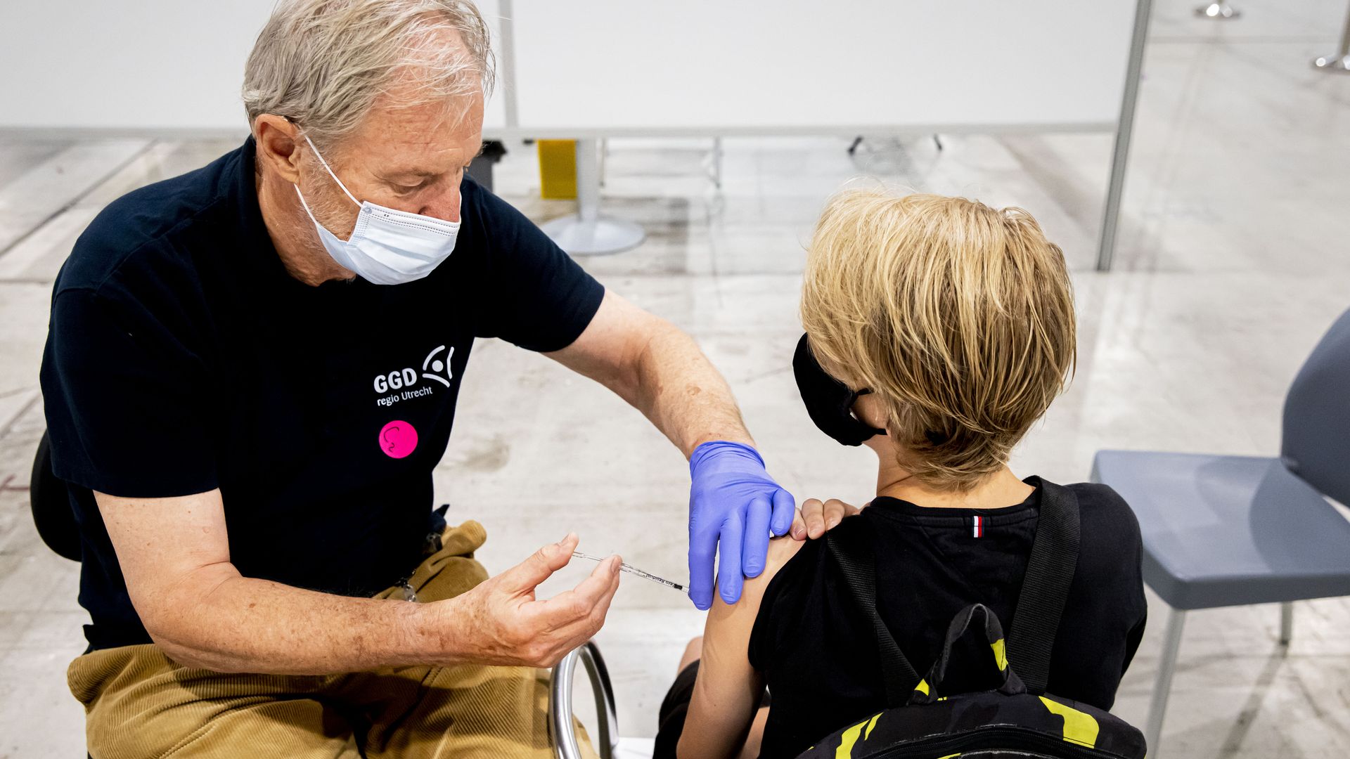 A picture of a child getting vaccinated in the Netherlands