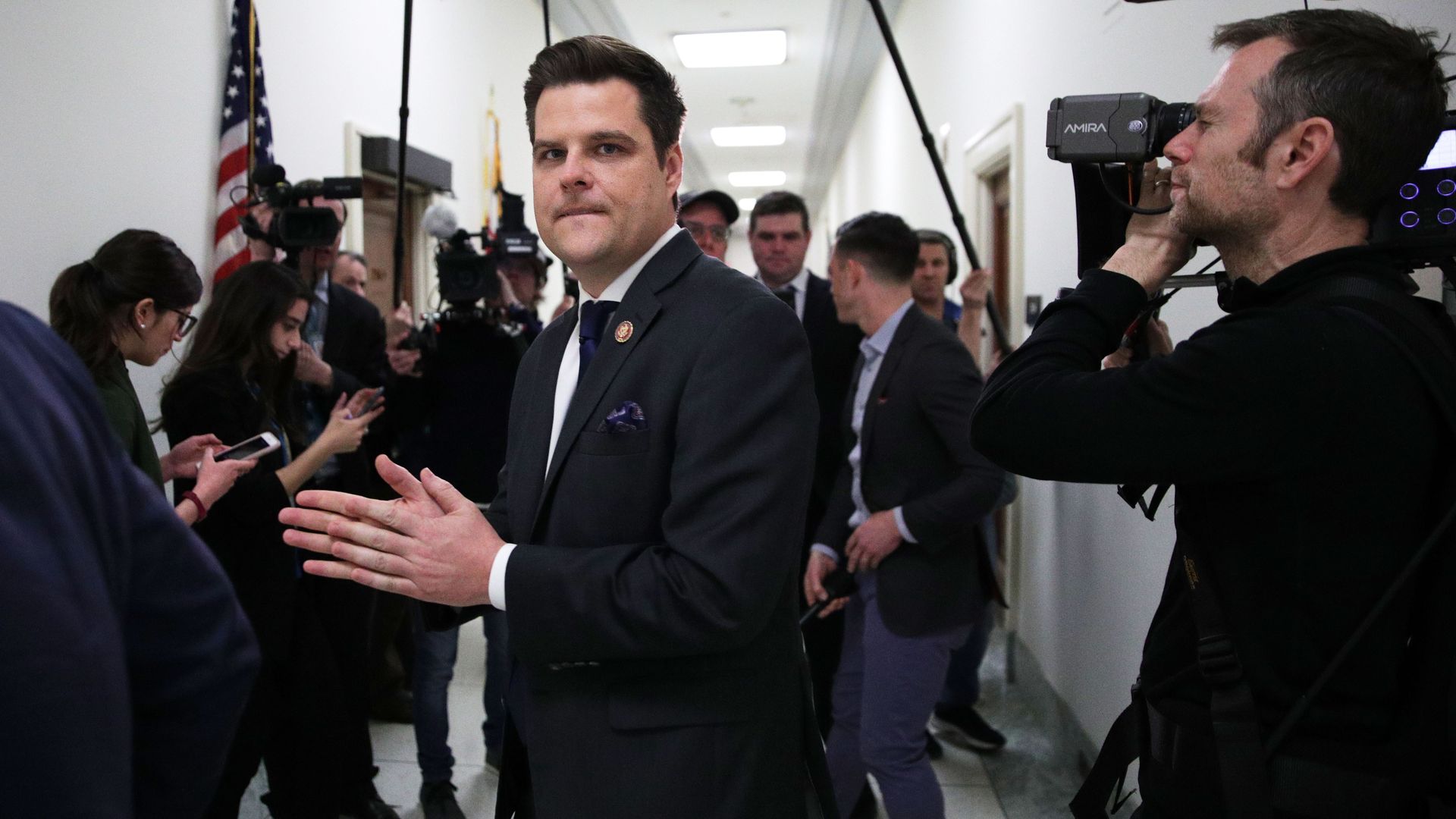 Rep. Matt Gaetz of Florida is seen surrounded by the media in a Capitol Hill hallway.