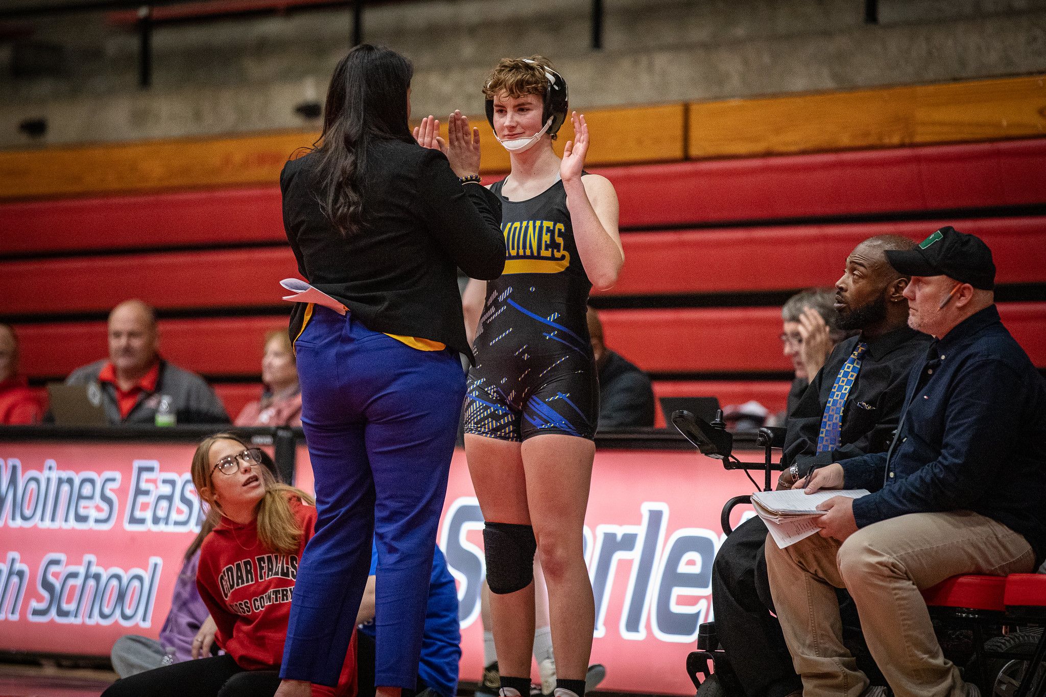Kendric Birden watches athletes at east wrestling meet