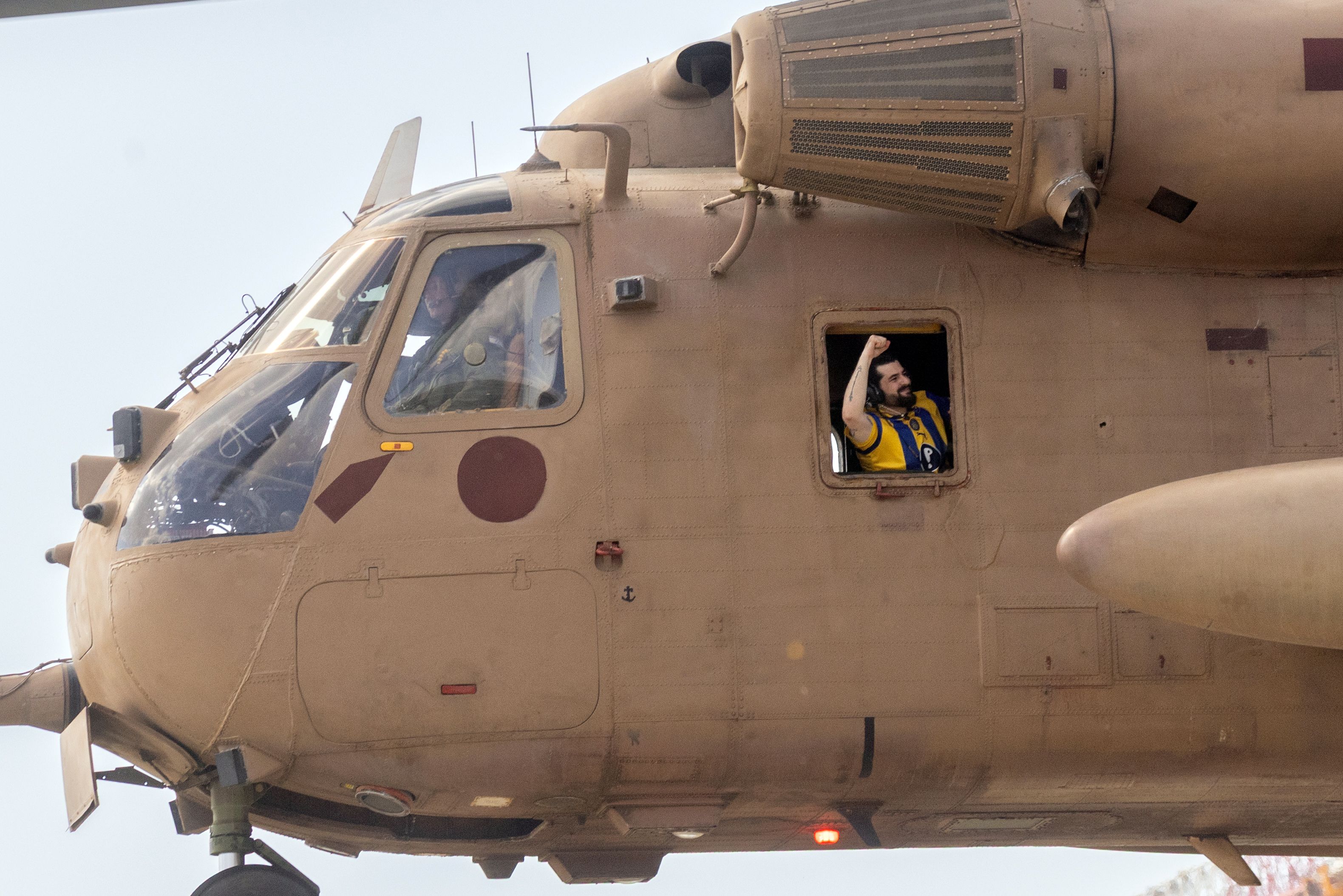Ziv Berman, an Israeli hostage released from Gaza, exults on his way to a hospital in Ramat Gan, Israel, on Monday. Photo: Avishag Shaar-Yashuv for The New York Times