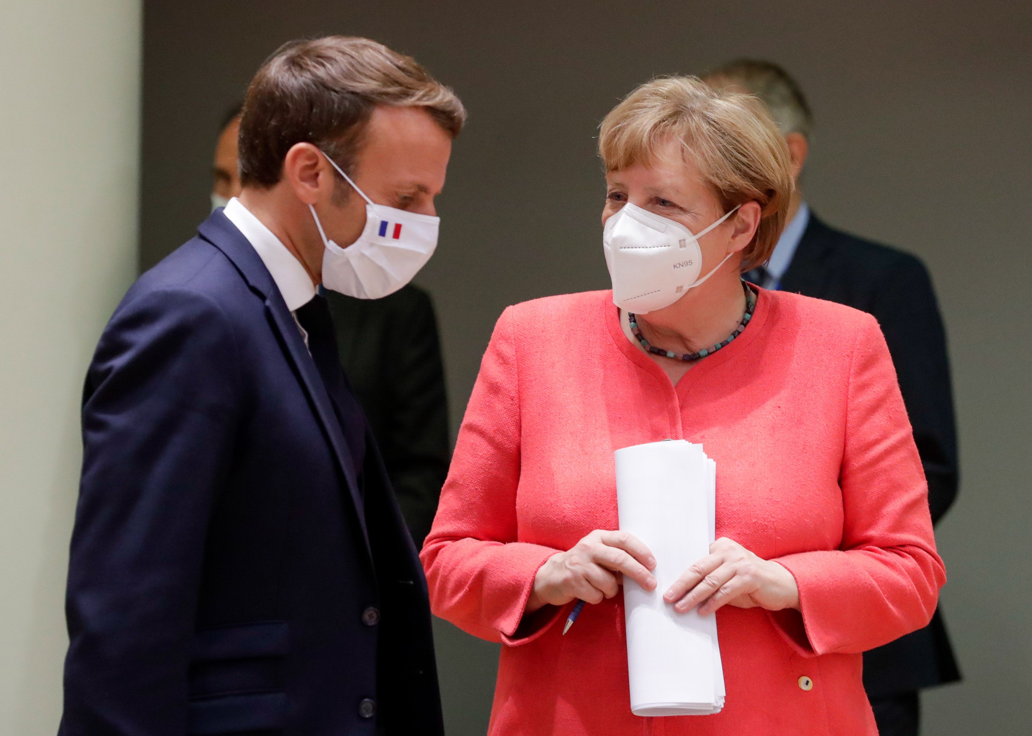 French President Emmanuel Macron and German Chancellor Angela Merkel during a last roundtable discussion following a four days European summit at the European Council in Brussels, Belgium on July 21