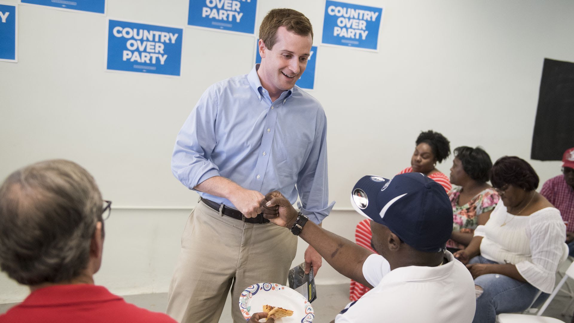 Congressional candidate Dan McCready shakes a voter's hand last month