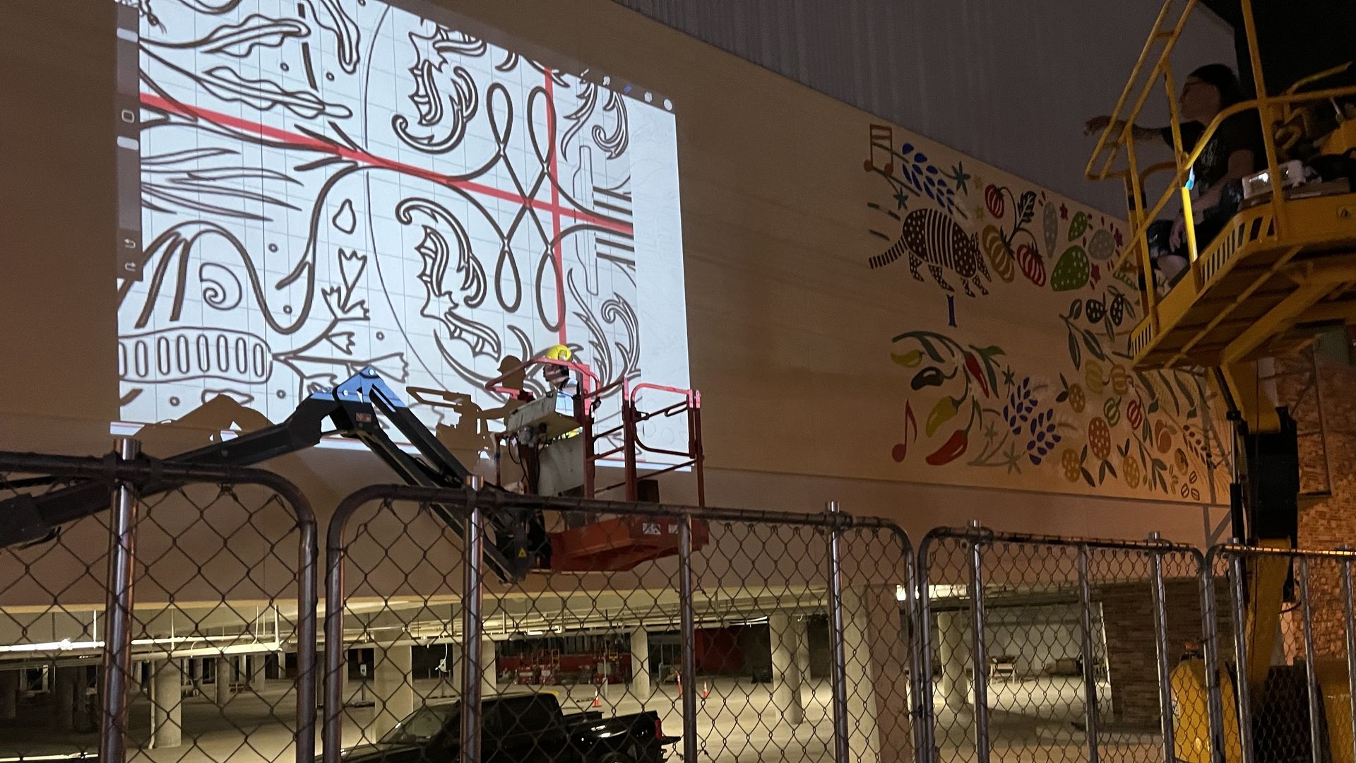 A photo of a mural being projected on a wall.