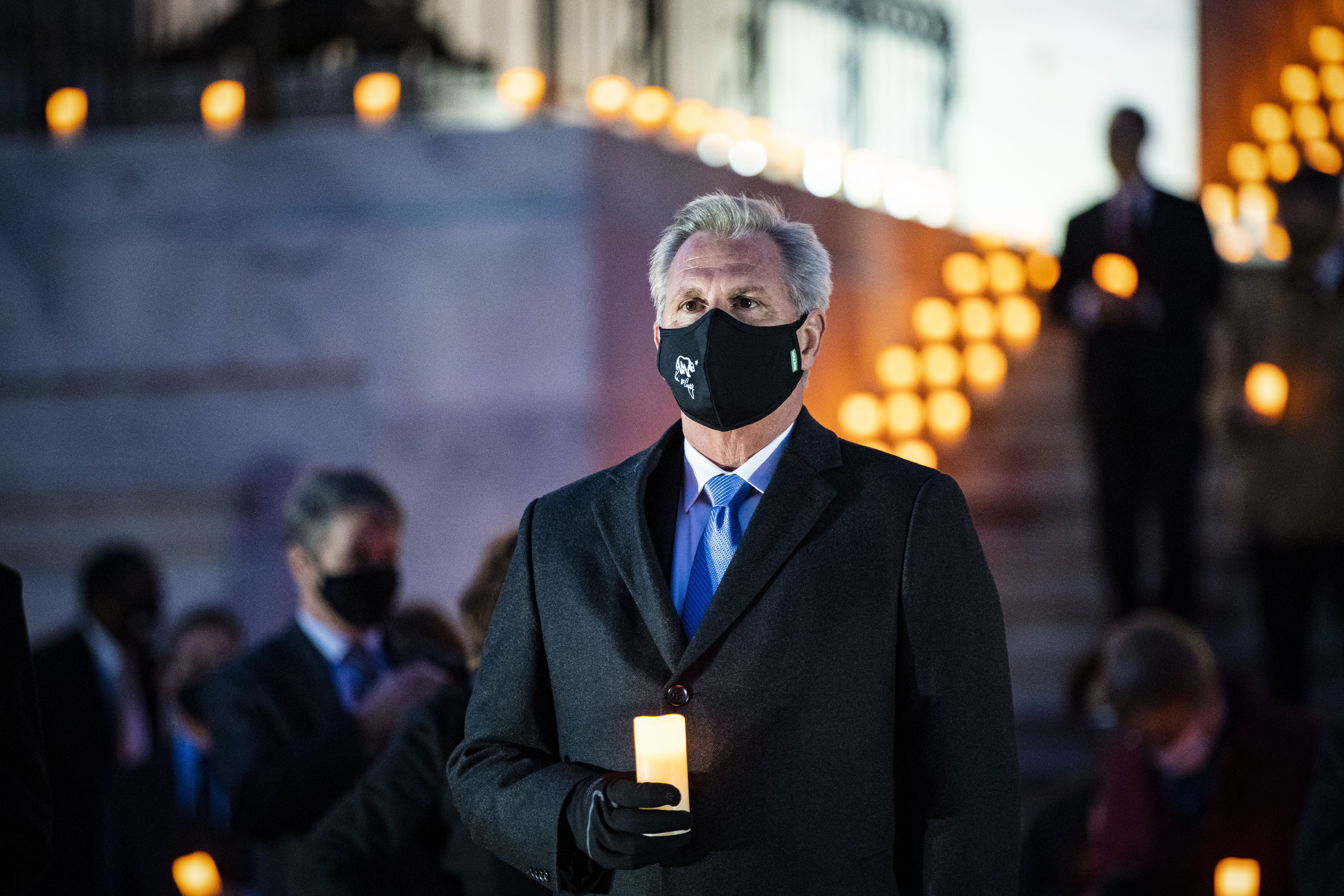 House Minority Leader Kevin McCarthy (R-Calif.) holding a candle outside of the Capitol on Feb. 23.