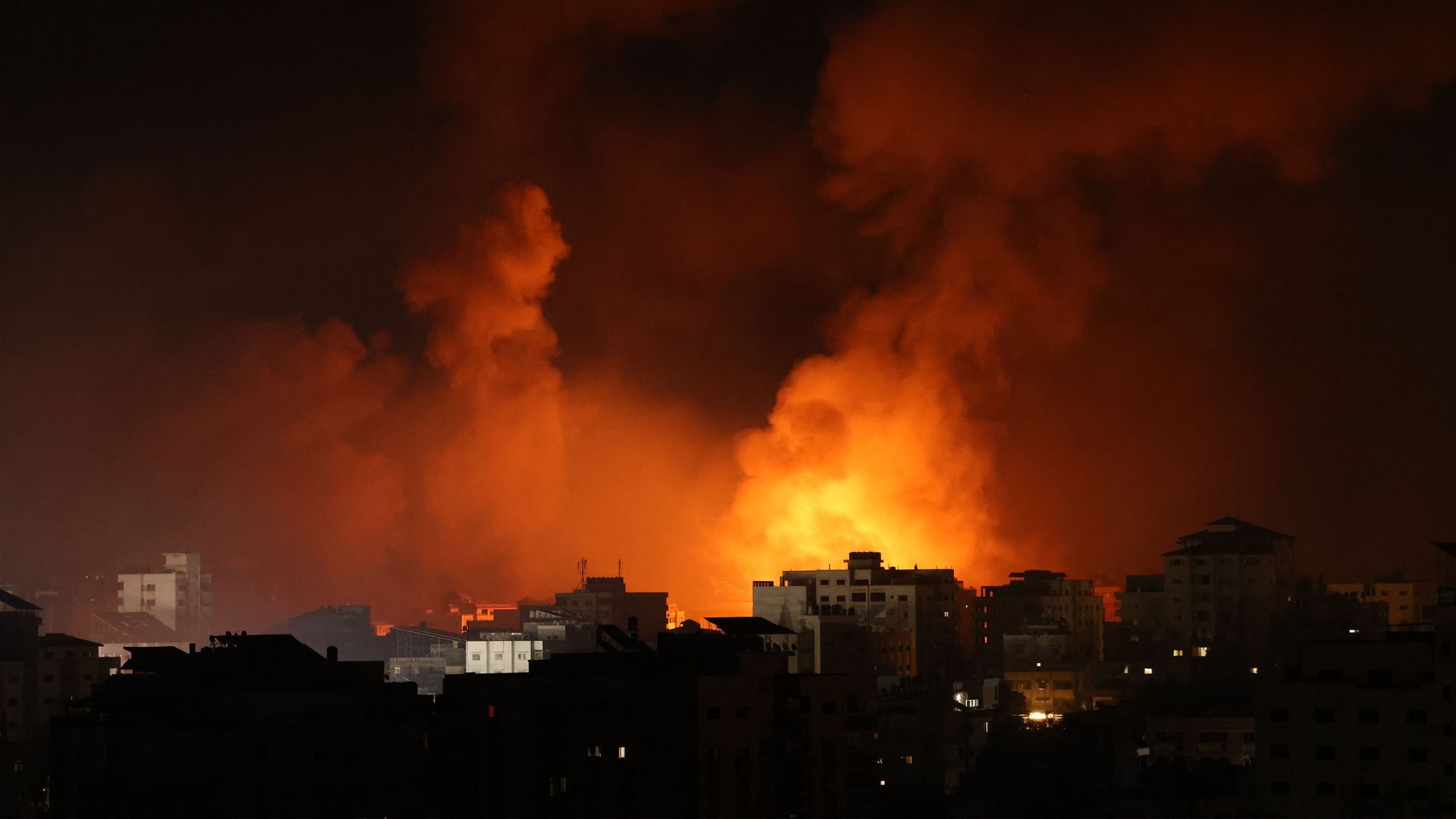 Smoke billows from a fire following Israeli airstrikes on multiple targets in Gaza on May 16. 