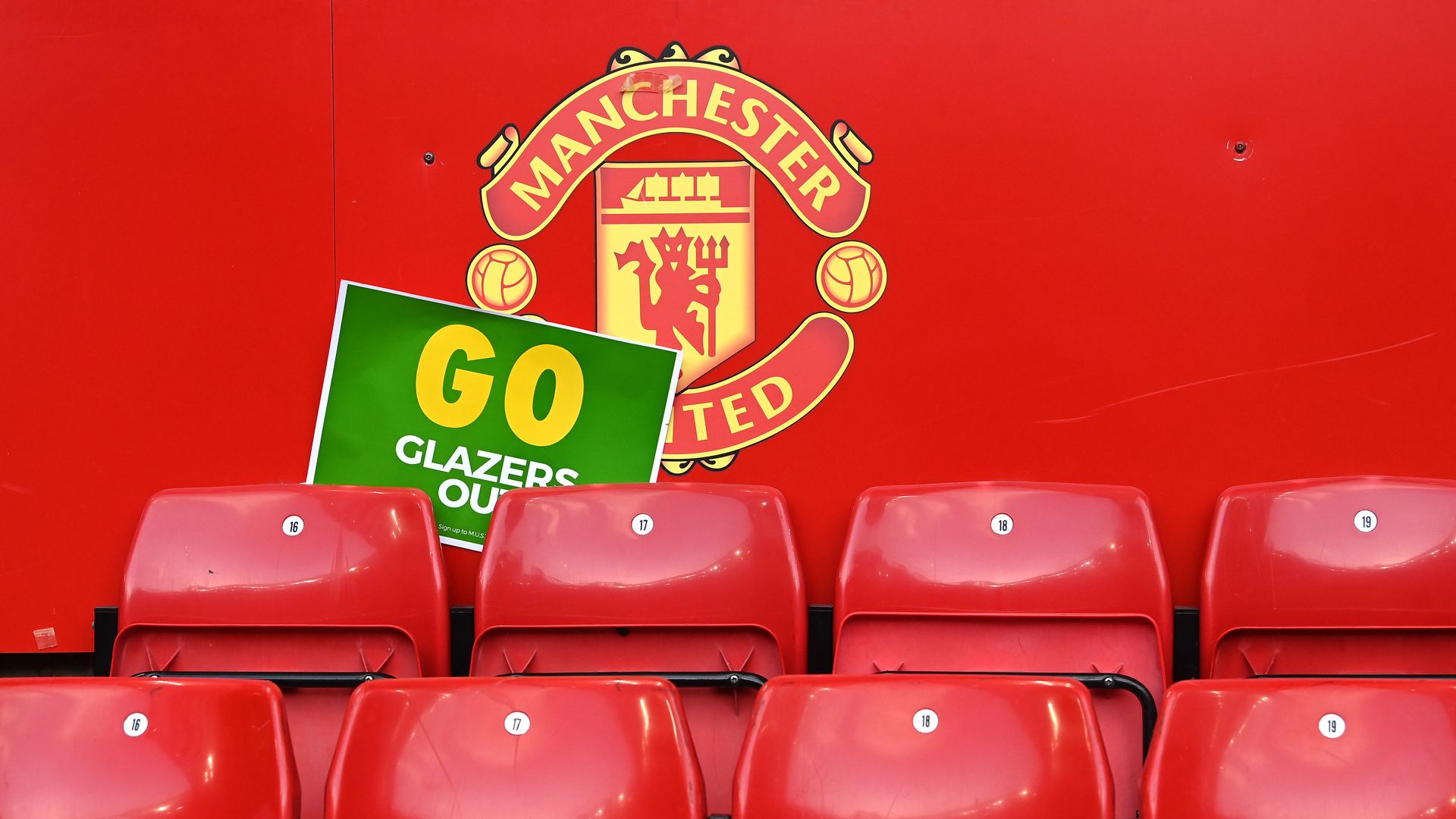 A general view of a GO Glazers Out protest poster in the stands after the Premier League match at Old Trafford, Manchester