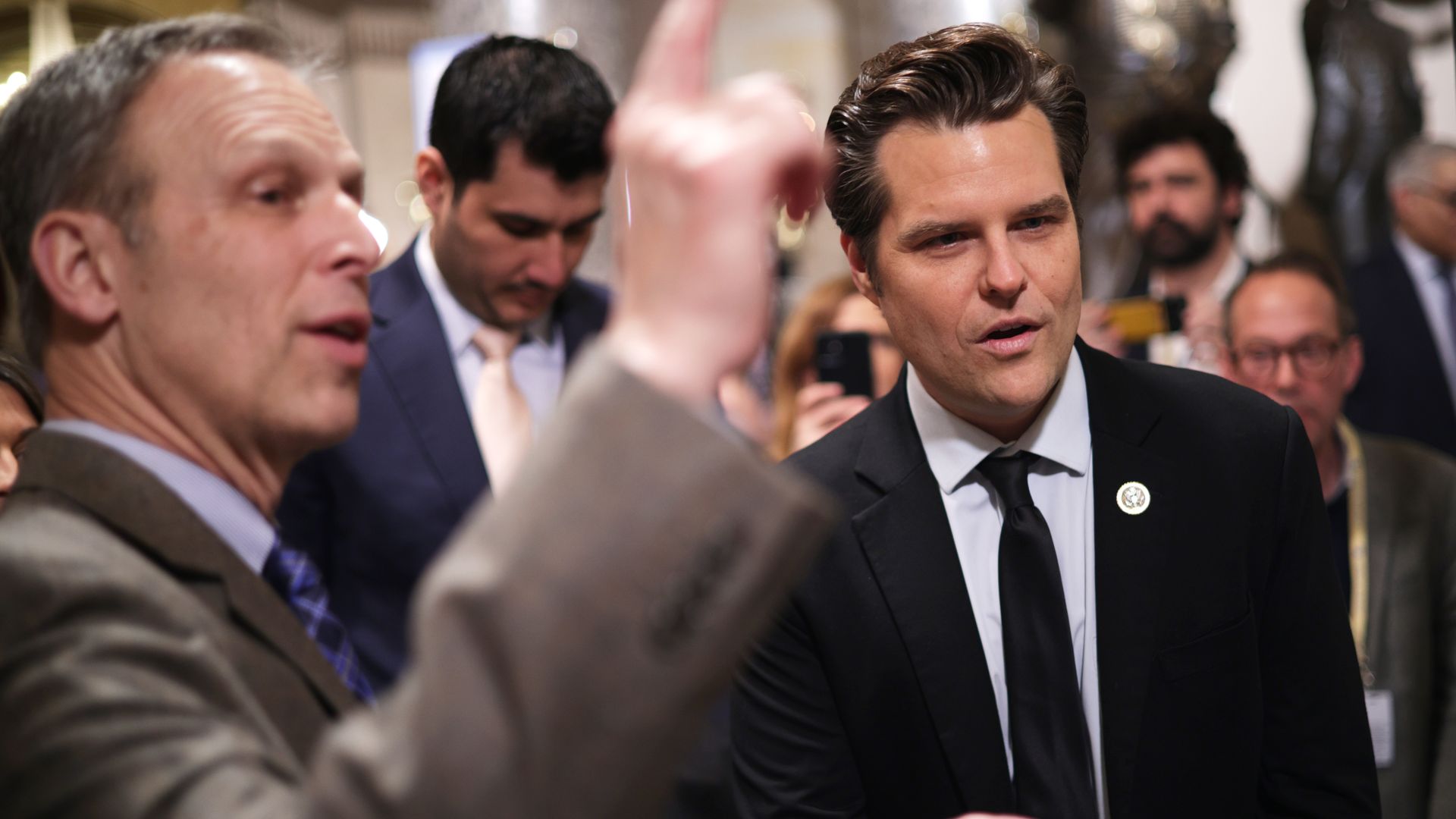U.S. Rep. Matt Gaetz (R-FL) (R) chats with Rep. Scott Perry (R-PA) (L) at the Statuary Hall of the U.S. Capitol