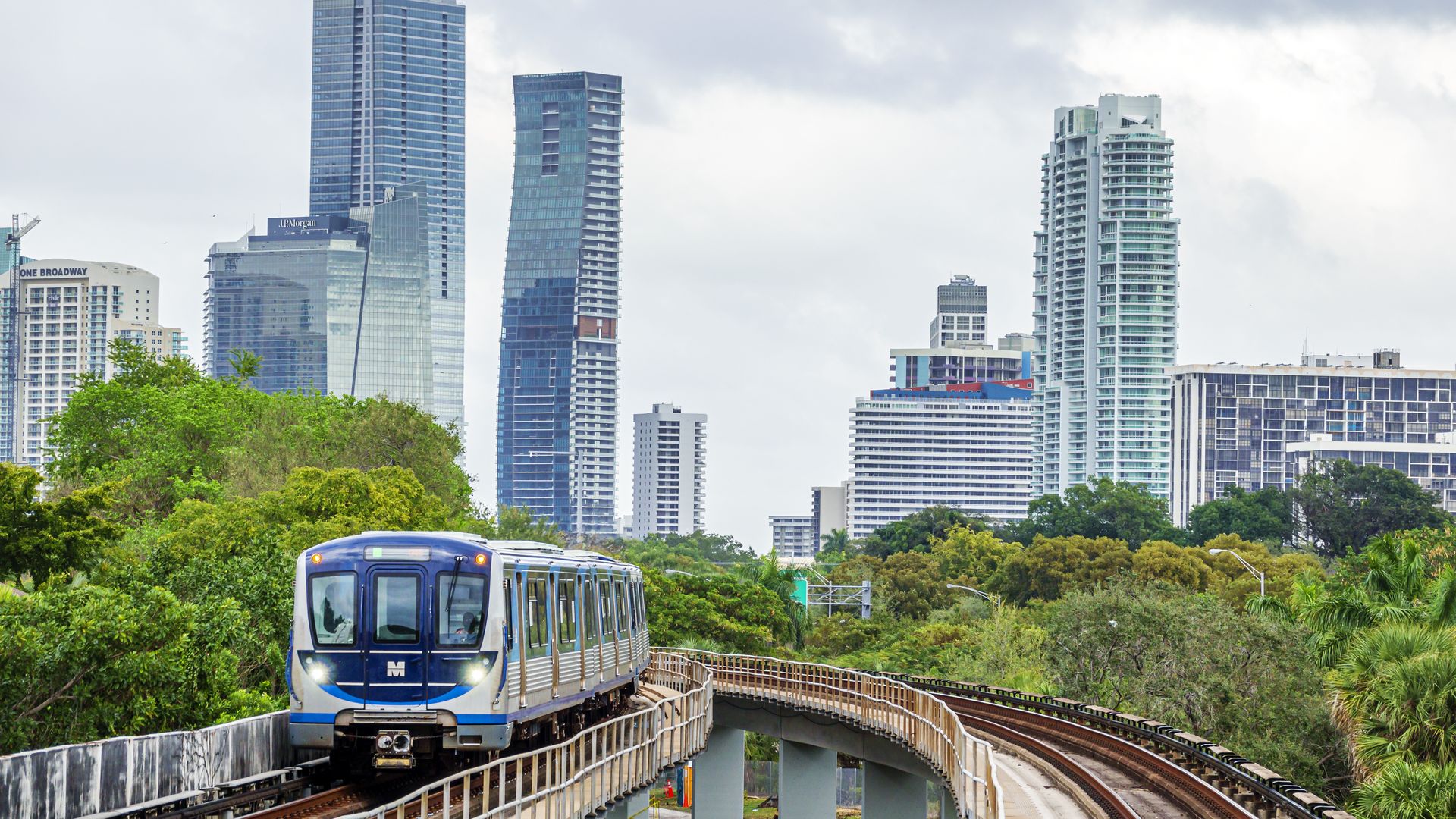 Miami's metrorail with tall buildings in the background. 