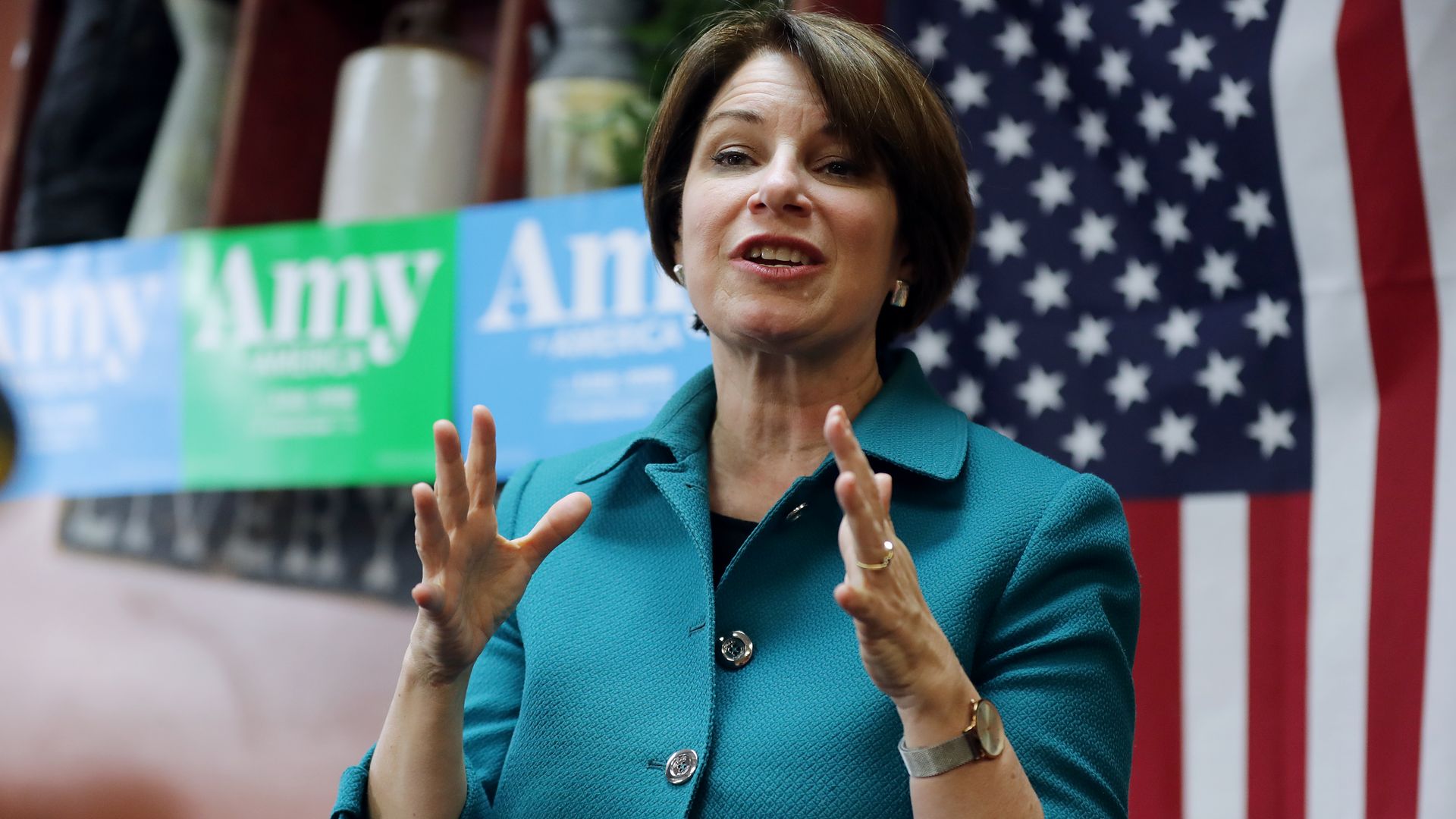 Amy klobuchar speaking in front of a crowd
