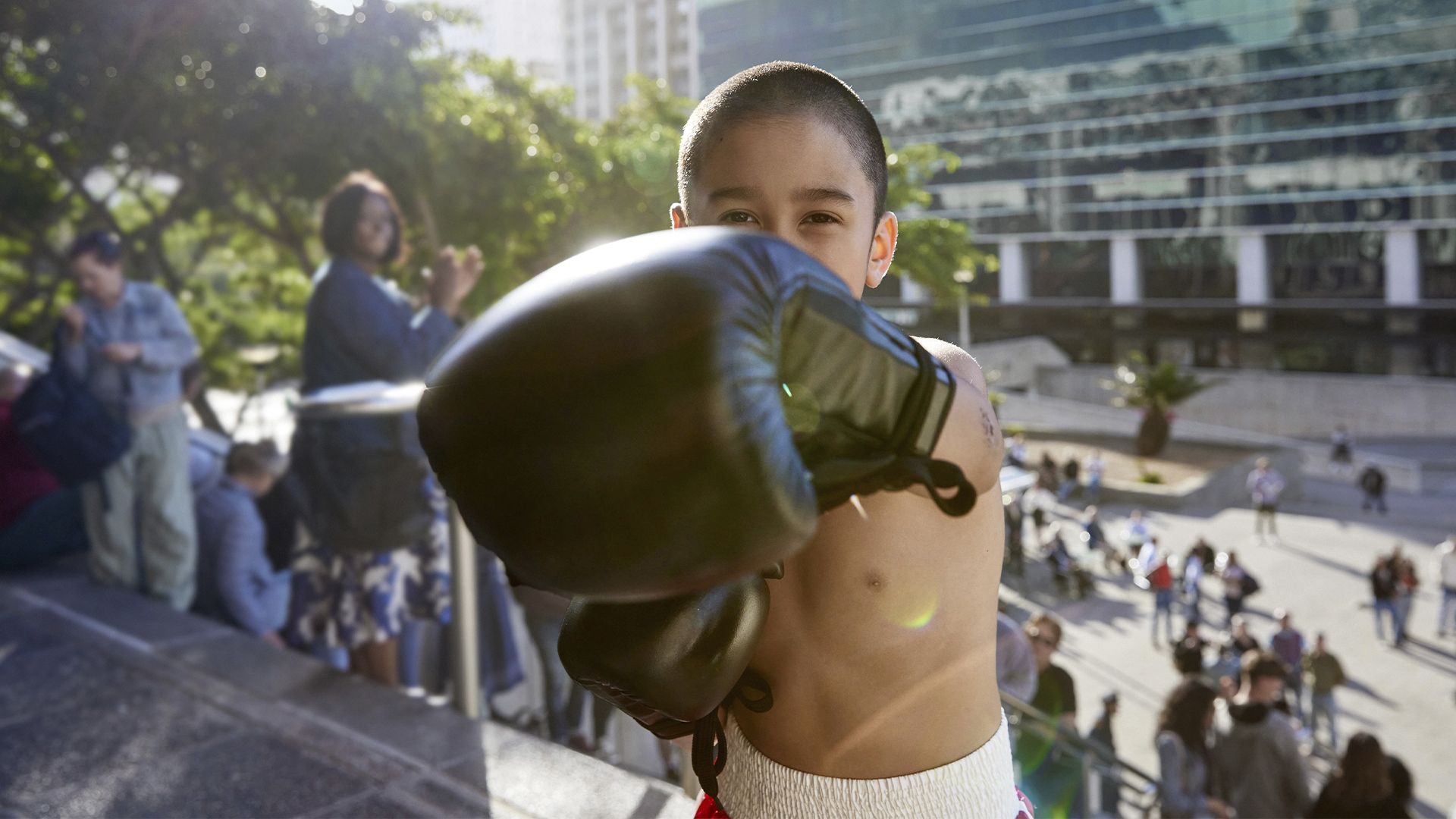 A boy punching the camera.