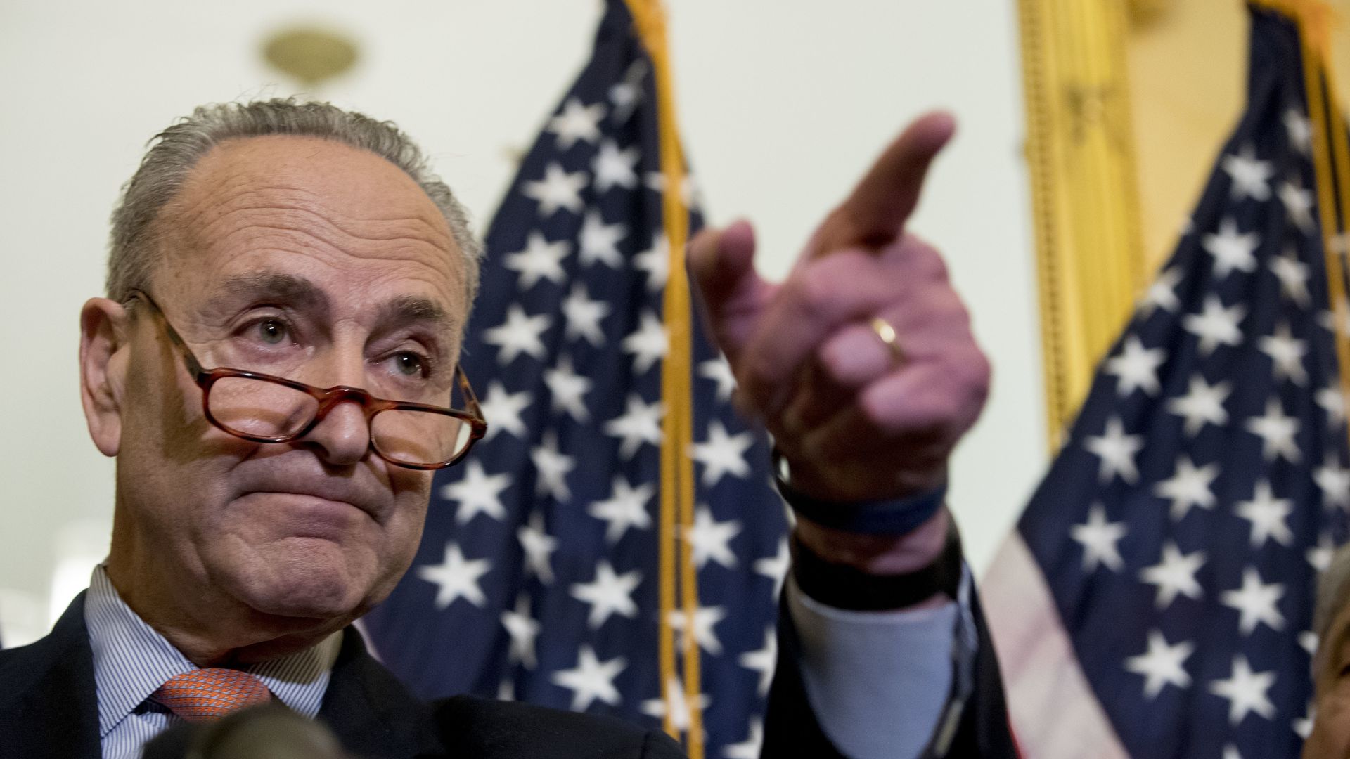 Chuck Schumer calling on a reporter during a press conference on Capitol Hill.