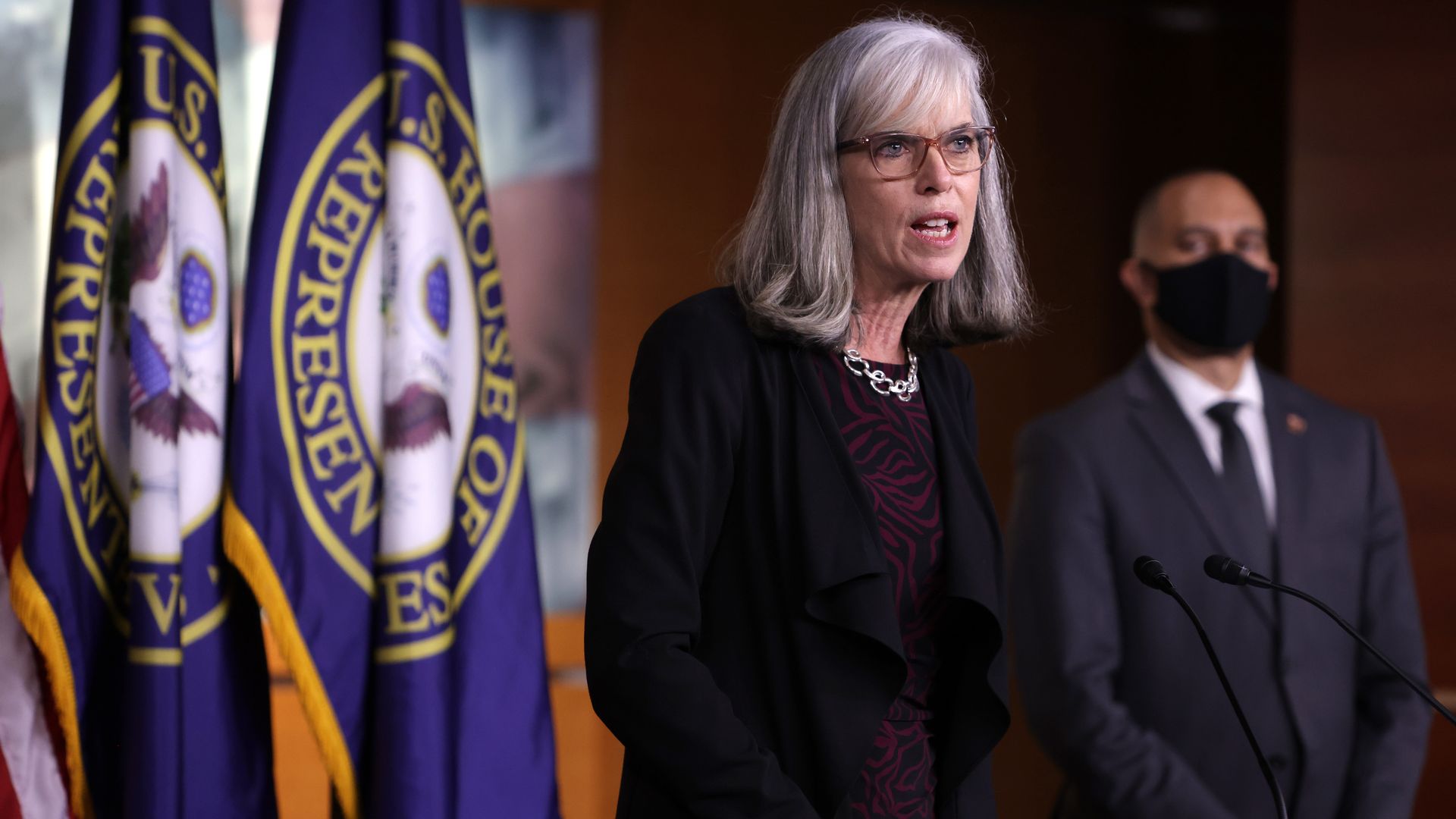 Rep. Katherine Clark is seen addressing reporters at the Capitol as Rep. Hakeem Jeffries looks on.