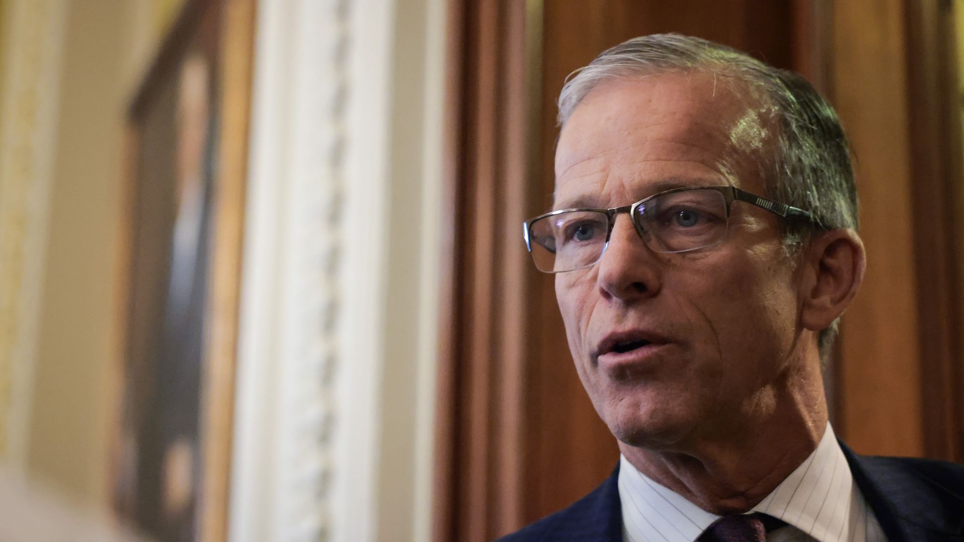 U.S. Senate Majority Leader John Thune (R-SD) speaks to press as he heads to the Senate Chambers to vote in the U.S. Capitol 