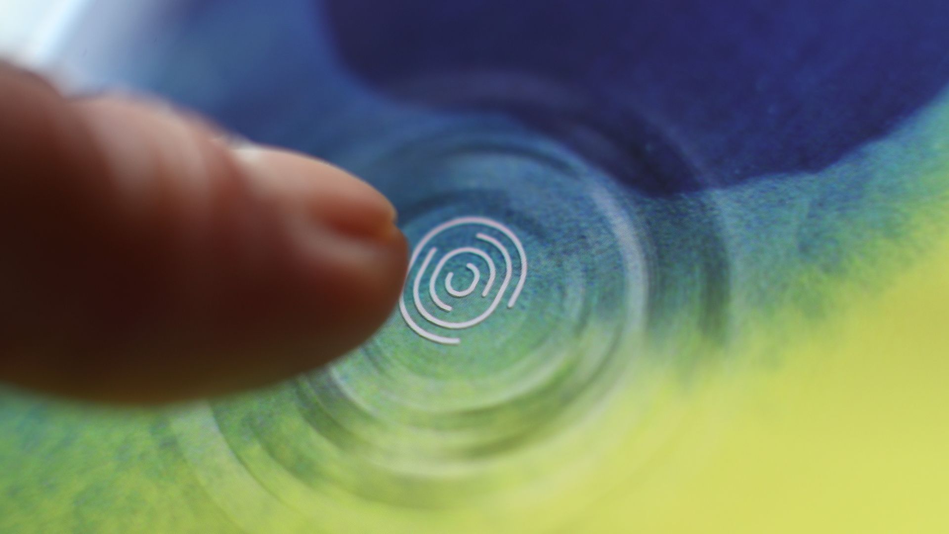 A finger shown unlocking a Samsung Galaxy phone.