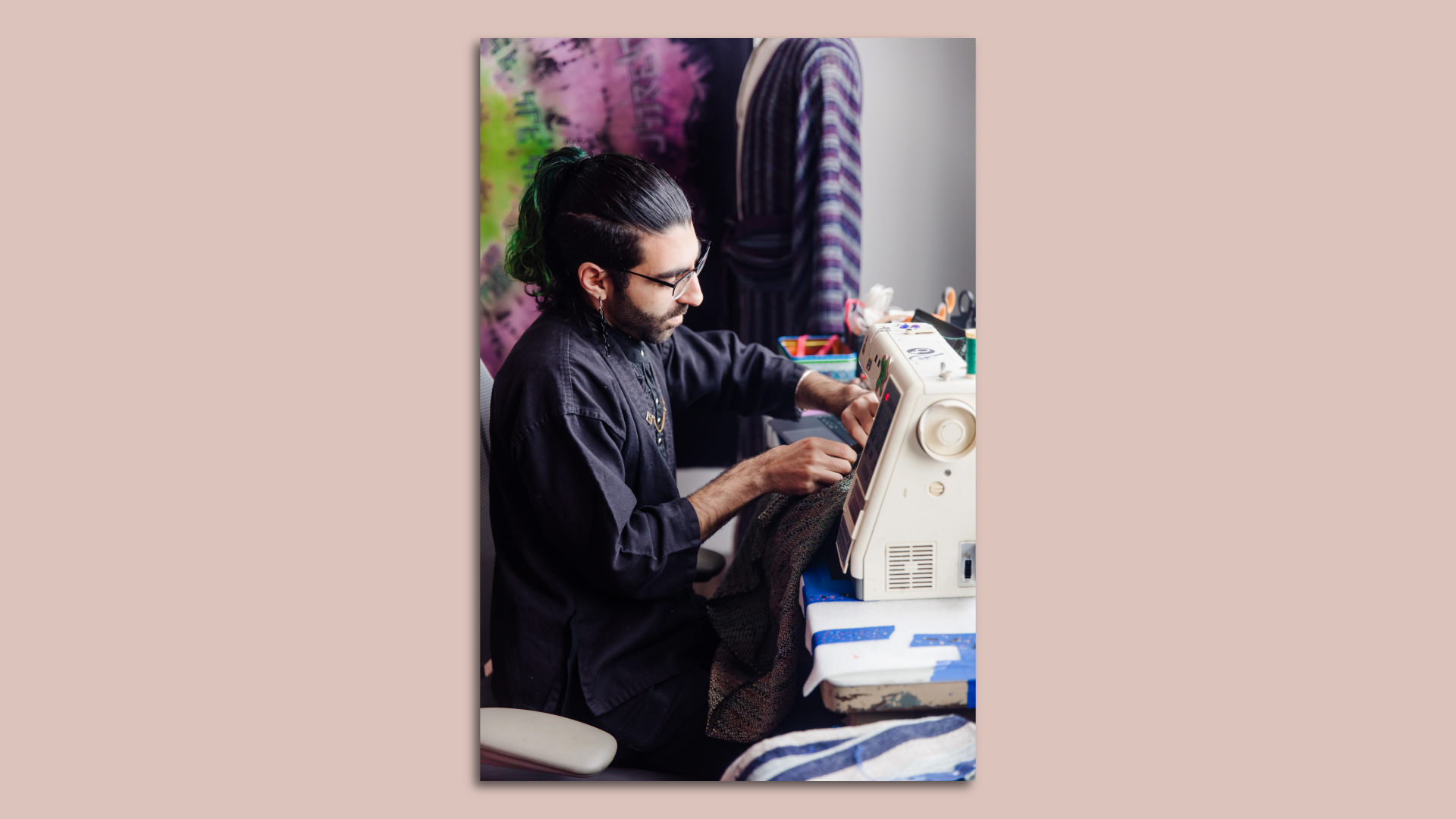 A portrait of the artist working.