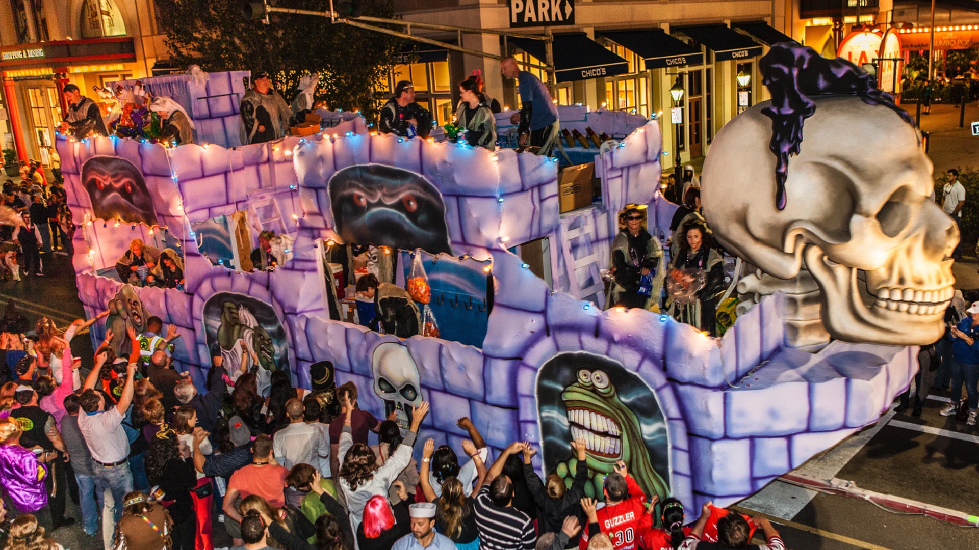 Image shows a parade float with a skull.
