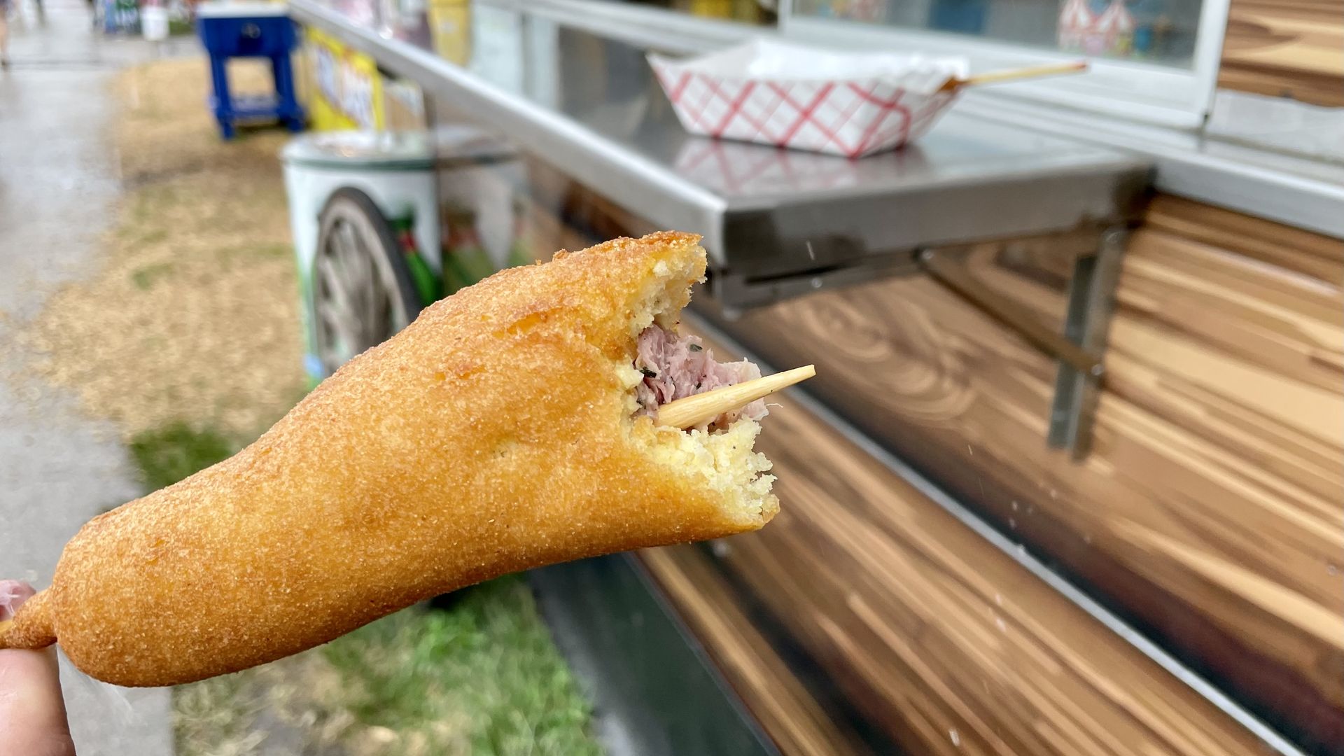 A photo of an alligator corn dog.