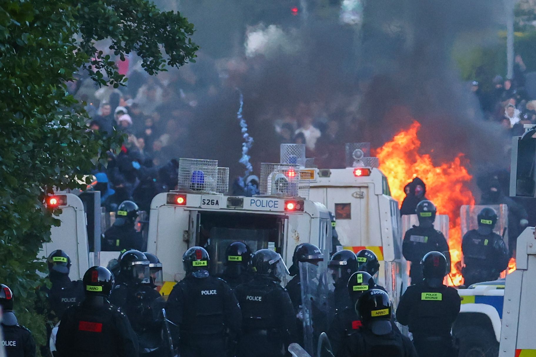 Police attempt to disperse protesters in Belfast, Northern Ireland, yesterday.