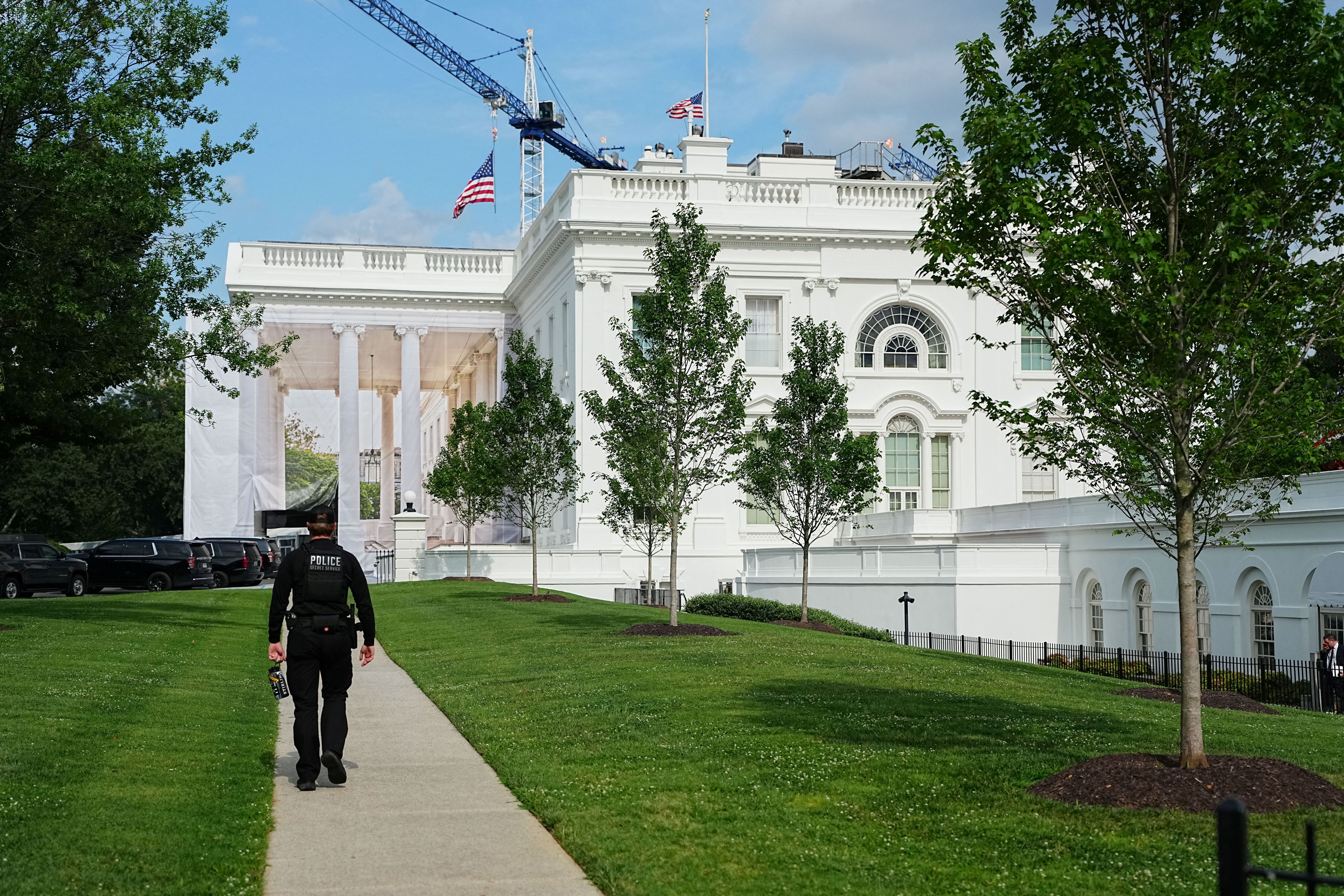 Flags fly at half-staff atop the White House yesterday in honor of Sen. Lindsey Graham (R-S.C.).