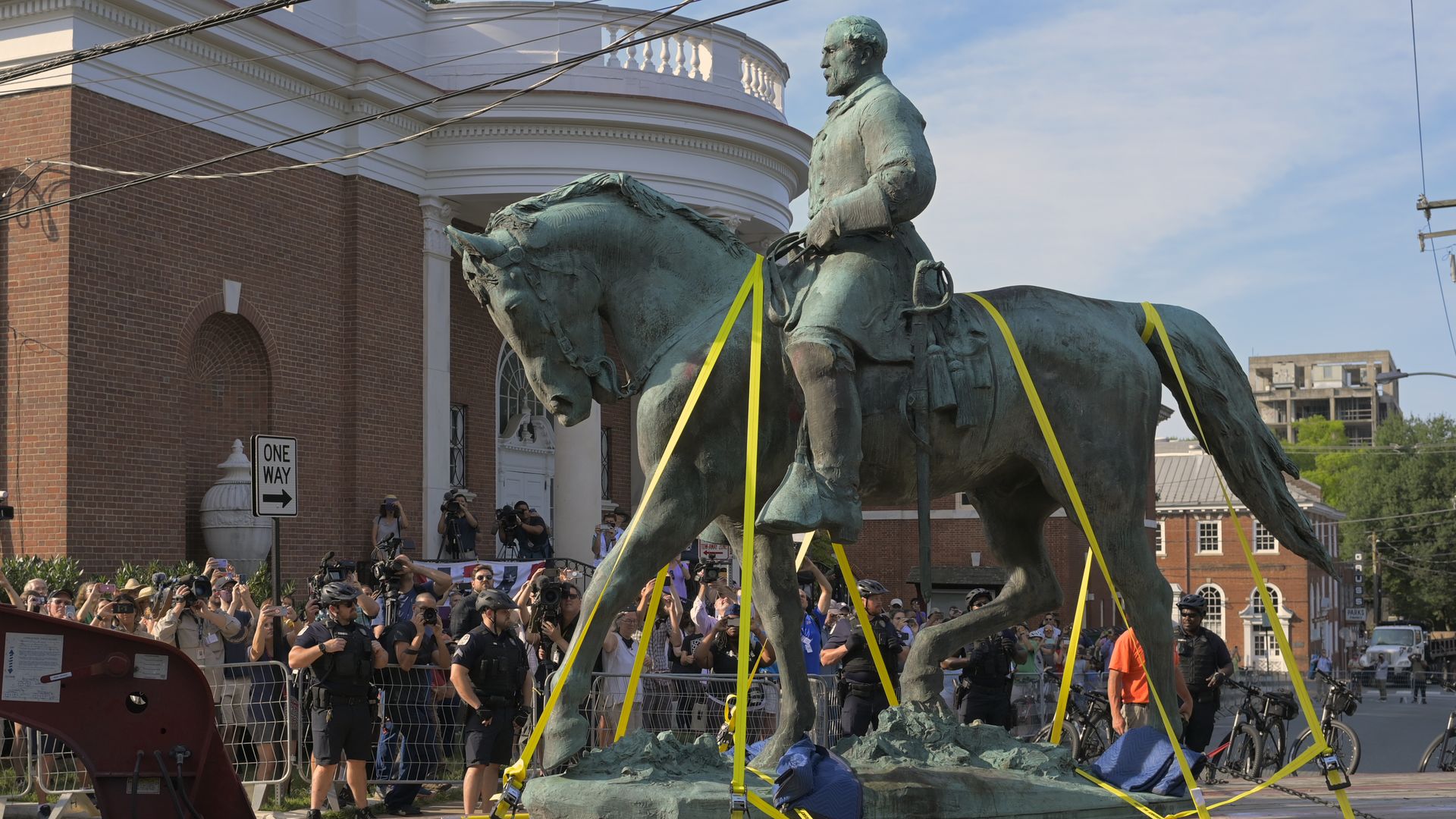 A statue of Confederate general Robert E Lee located in Charlottesvilles is transported away on East Jefferson street.