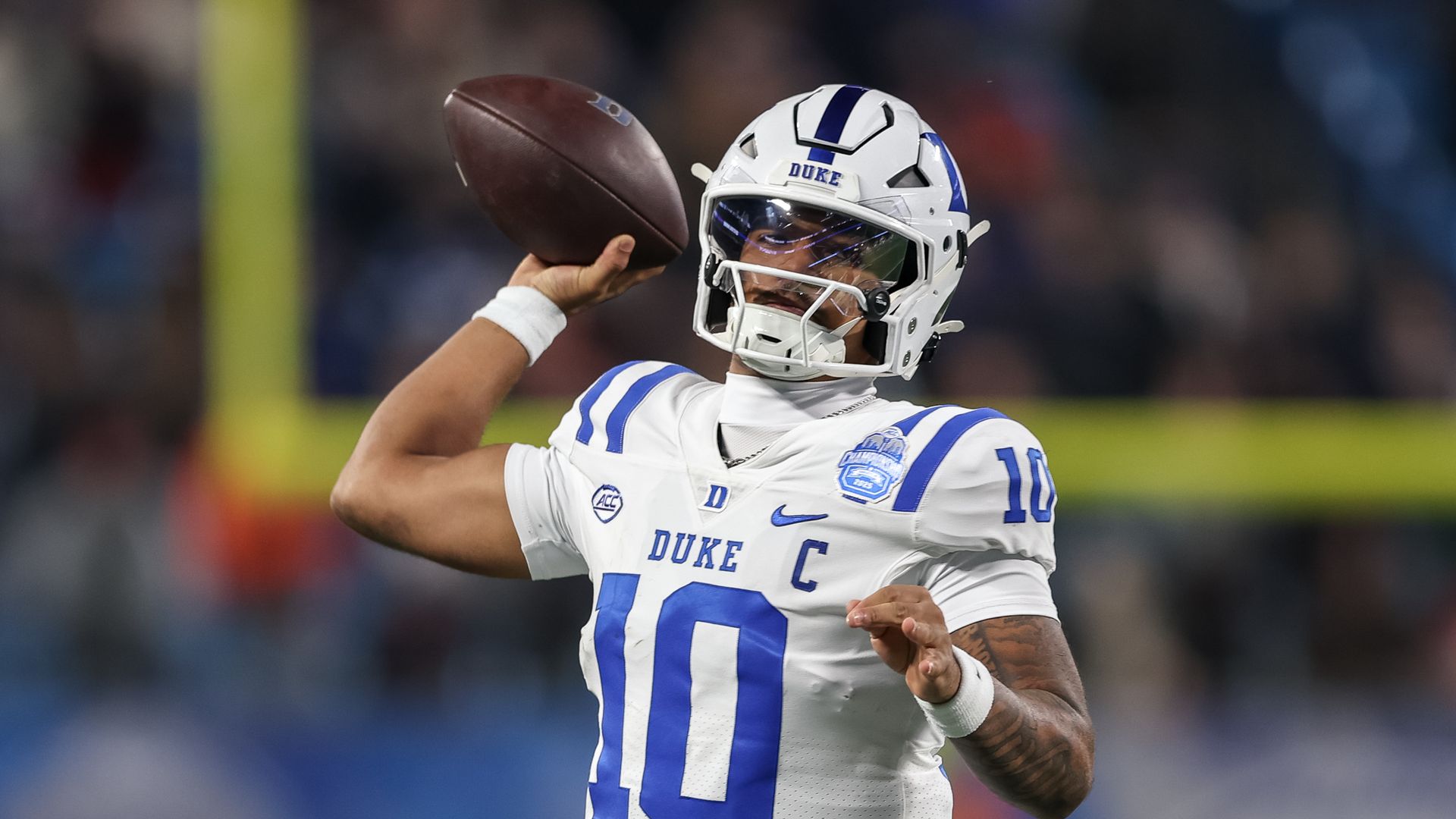 CHARLOTTE, NORTH CAROLINA - DECEMBER 6: Darian Mensah #10 of the Duke Blue Devils throws a pass against the Virginia Cavaliers during the second half of the ACC Championship game at Bank of America Stadium on December 6, 2025 in Charlotte, North Carolina. (Photo by Cory Knowlton/ISI Photos/ISI Photo