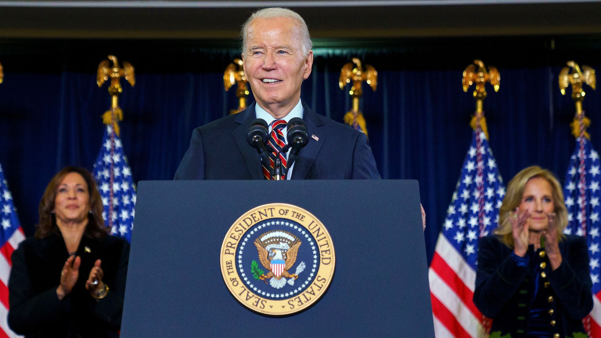 Vice President Kamala Harris, from left, President Joe Biden, and First Lady Jill Biden during the Democratic National Committee's holiday reception in Washington, DC, US, on Sunday, Dec. 15, 2024. 