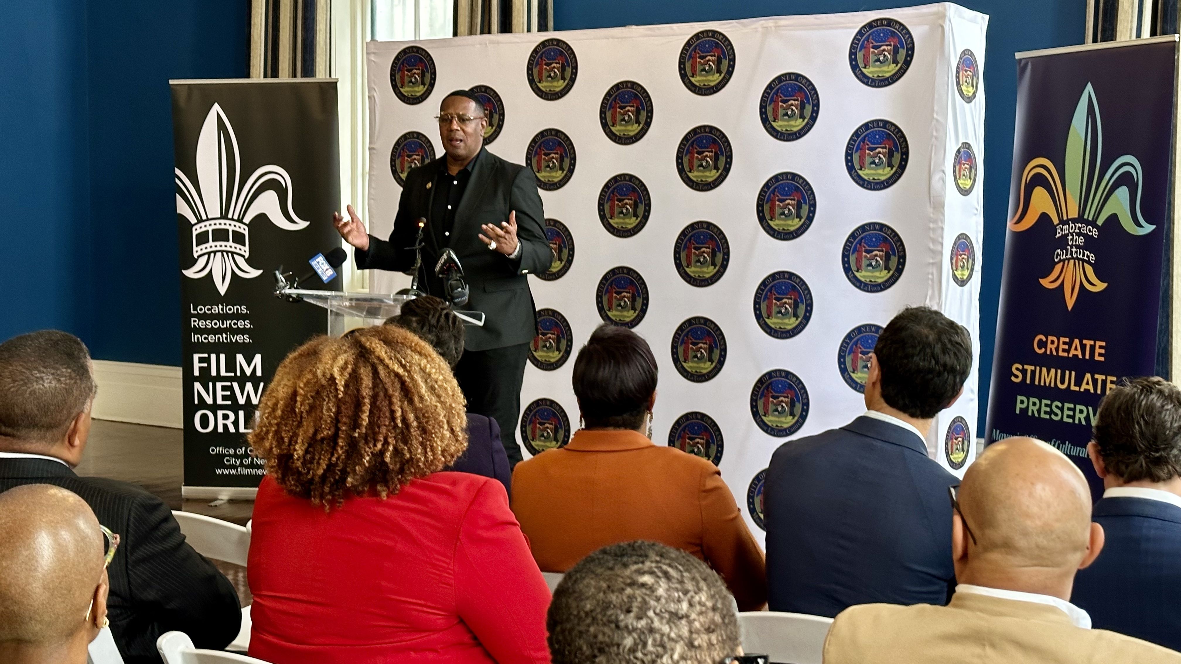 Photo shows Master P talking at a press conference.